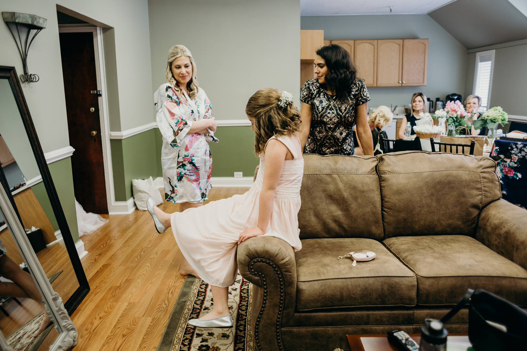 a bridesmaid getting ready at the upper montclair country club in montclair, new jersey
