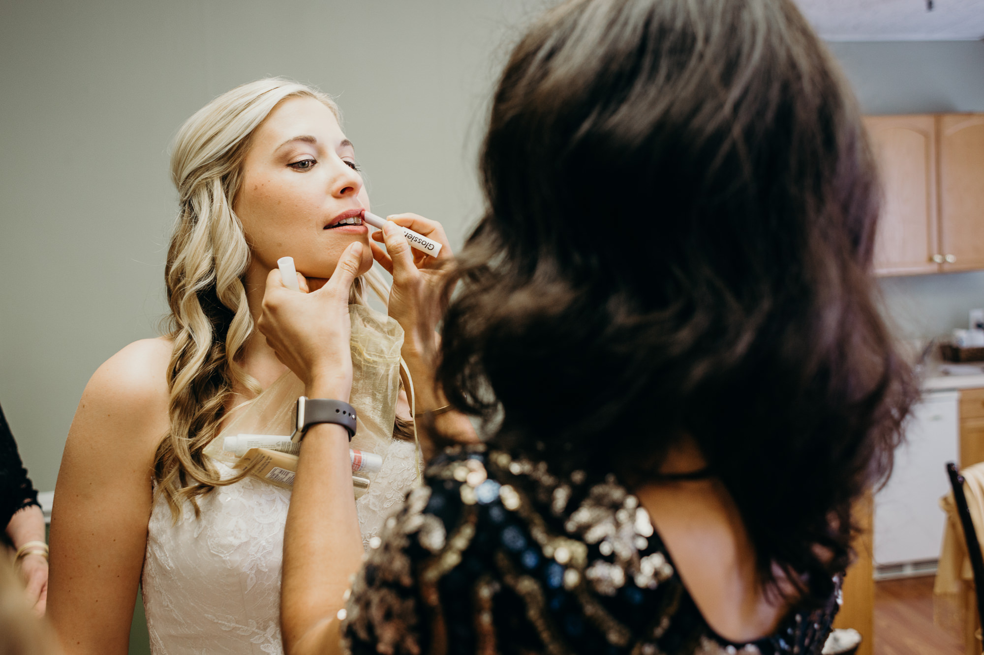 a bride getting ready for her wedding at at the upper montclair country club in montclair, new jersey
