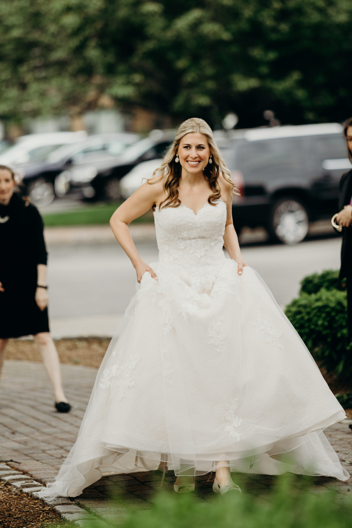 a bride walks to her first look at the upper montclair country club in montclair, new jersey