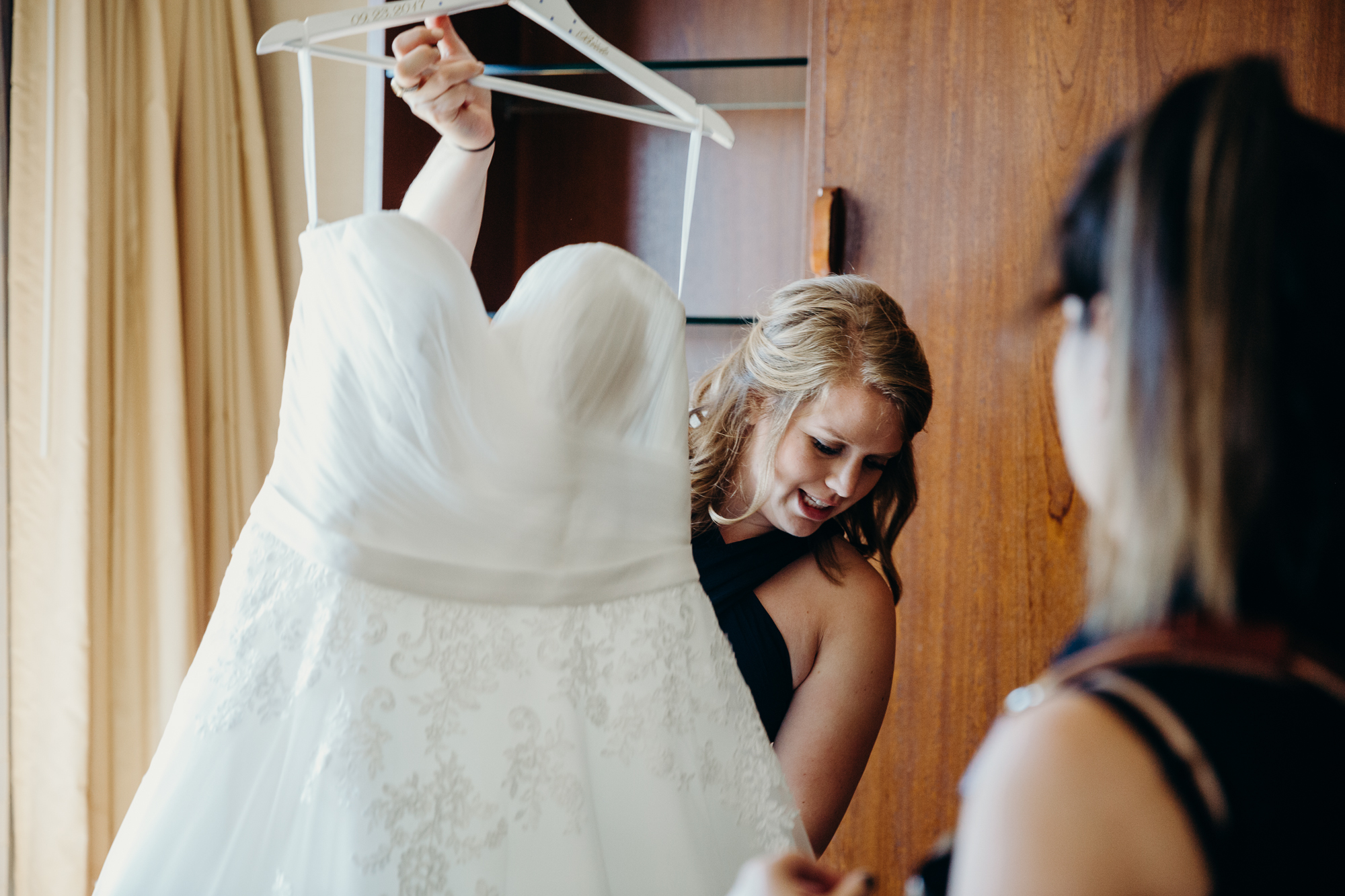 bridesmaid with wedding gown at country club of darien in darien, connecticut