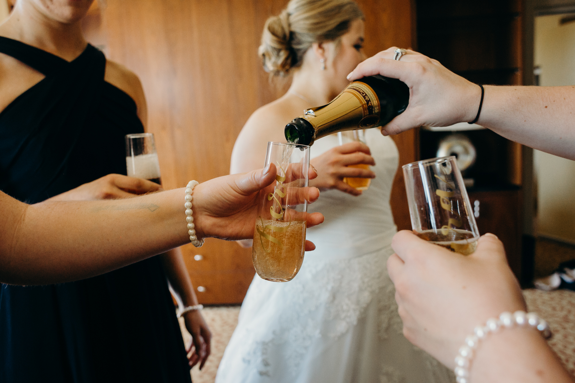 pouring champagne at country club of darien in darien, connecticut