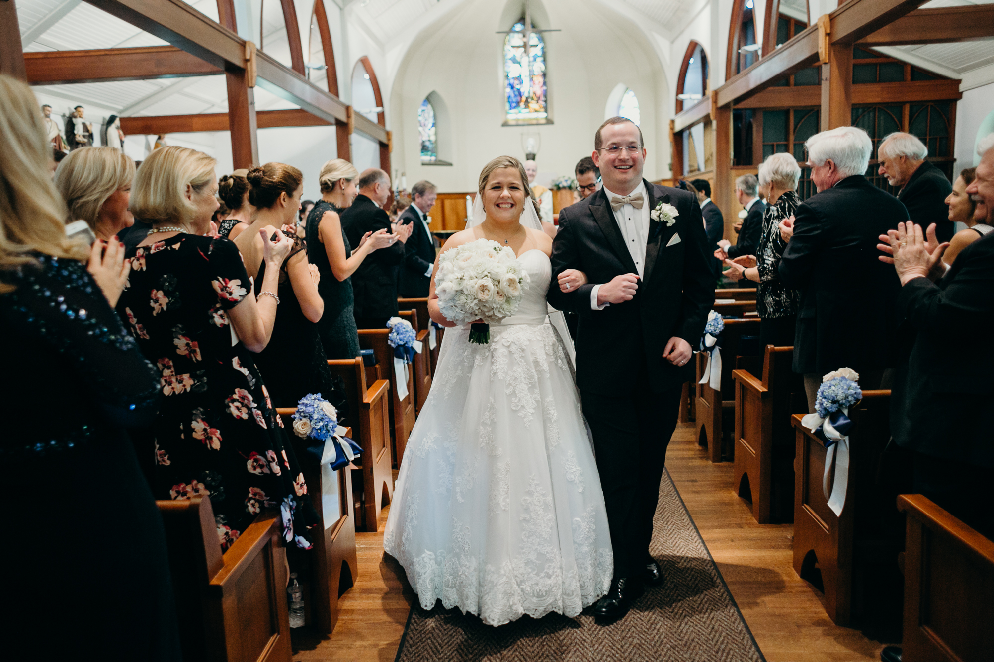 bride and groom celebrate during their wedding ceremony at country club of darien in darien, connecticut