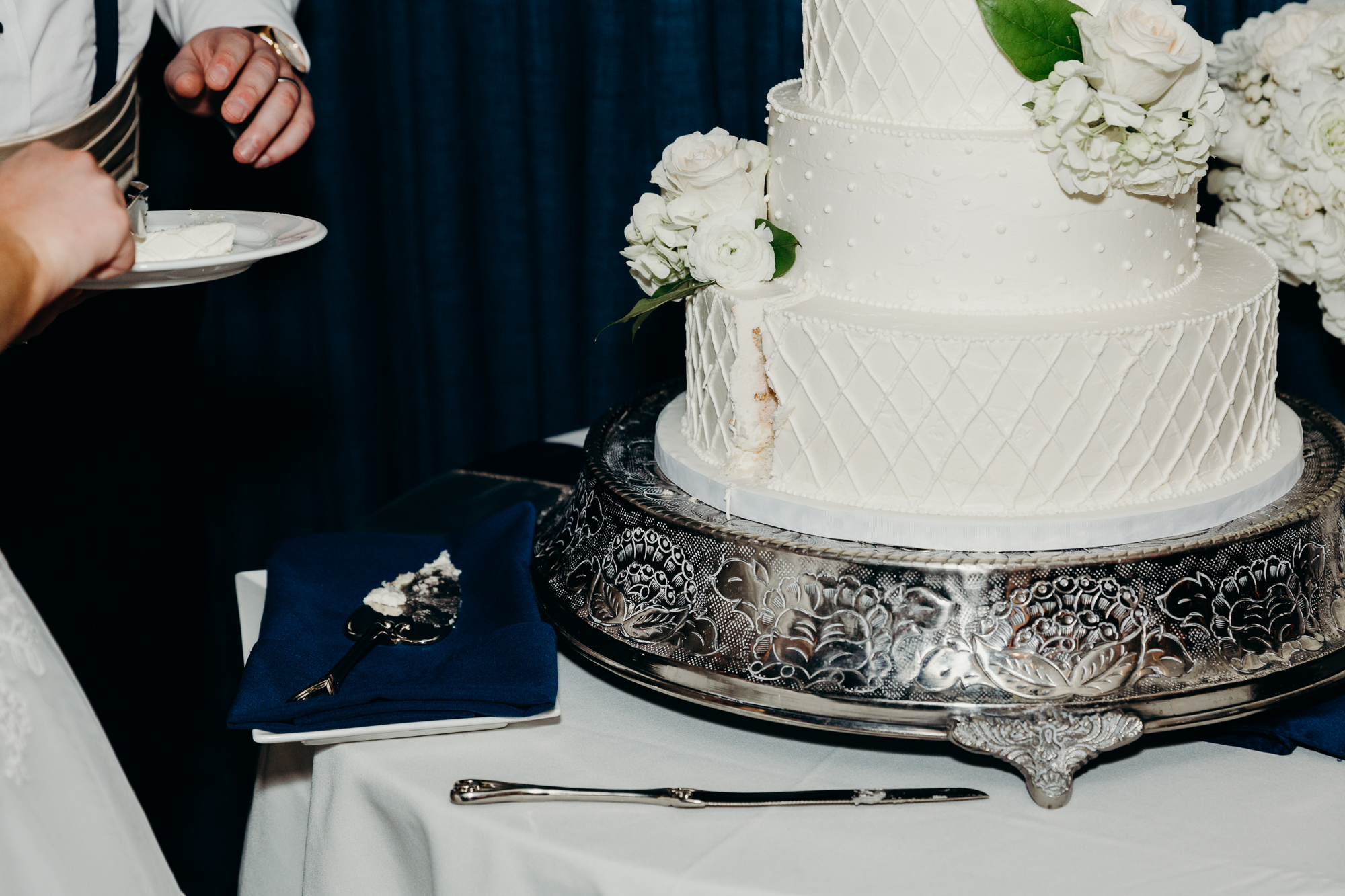 cut wedding cake at country club of darien in darien, connecticut