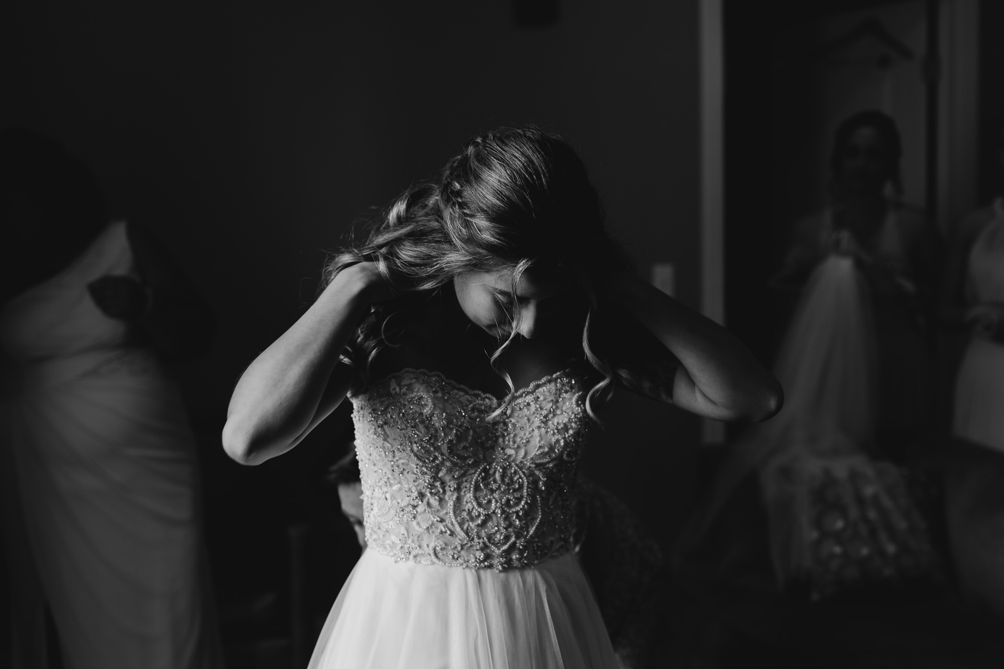 a bride getting into her wedding gown at the lafayette hotel in buffalo, ny