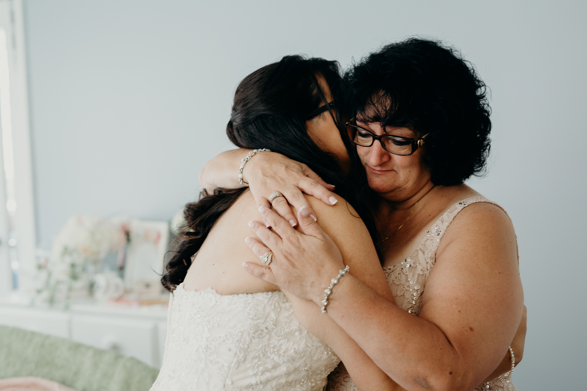 bride hugging her mother at a private estate in connecticut