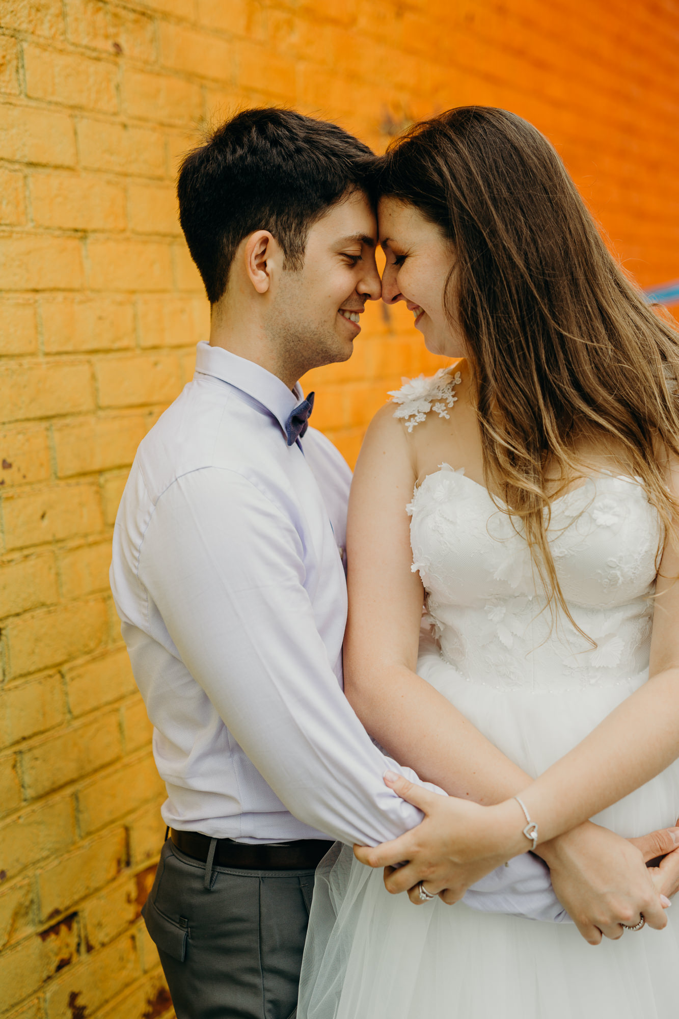 a portrait of a bride and groom in DUMBO in brooklyn, new york