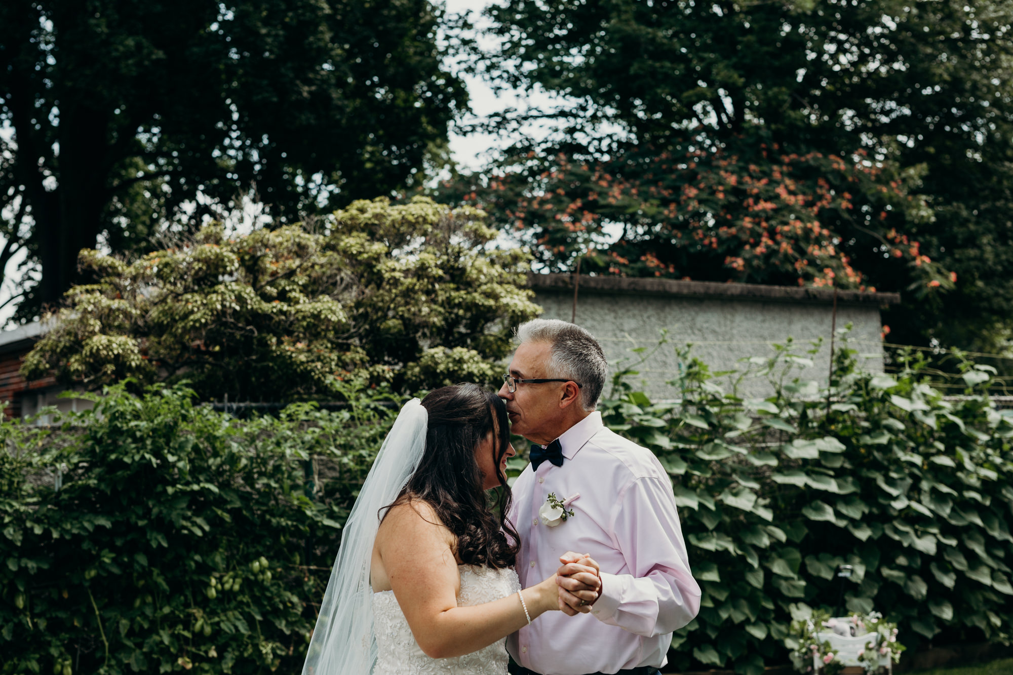 a bride dances with her father at her home in connecticut