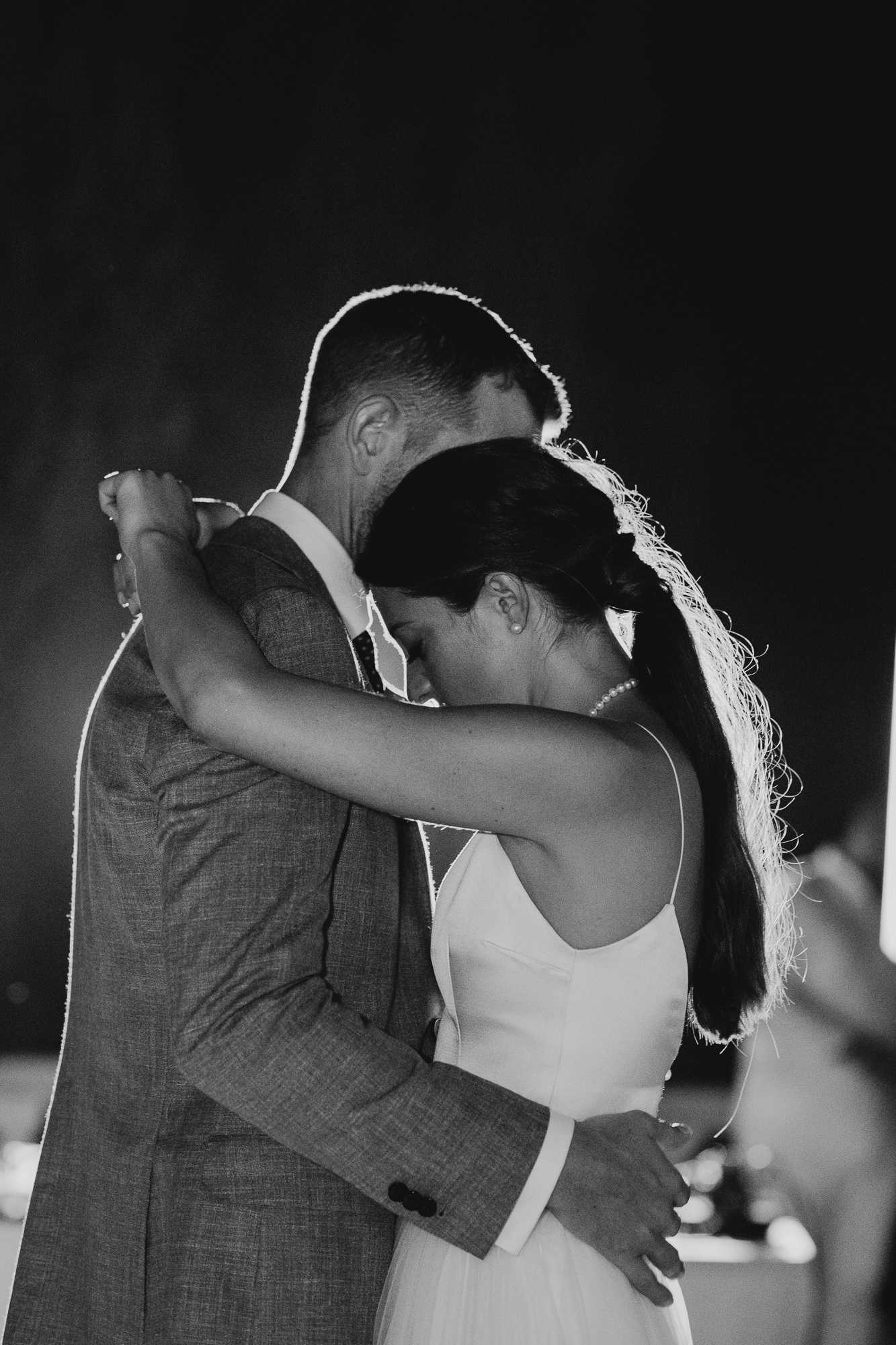 a bride and groom dance together during their wedding reception at casa de los bates in nerja, spain