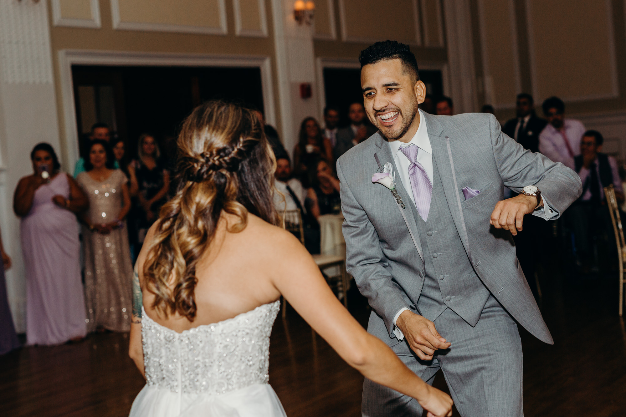a bride dances with her brother at the lafayette hotel in buffalo, ny
