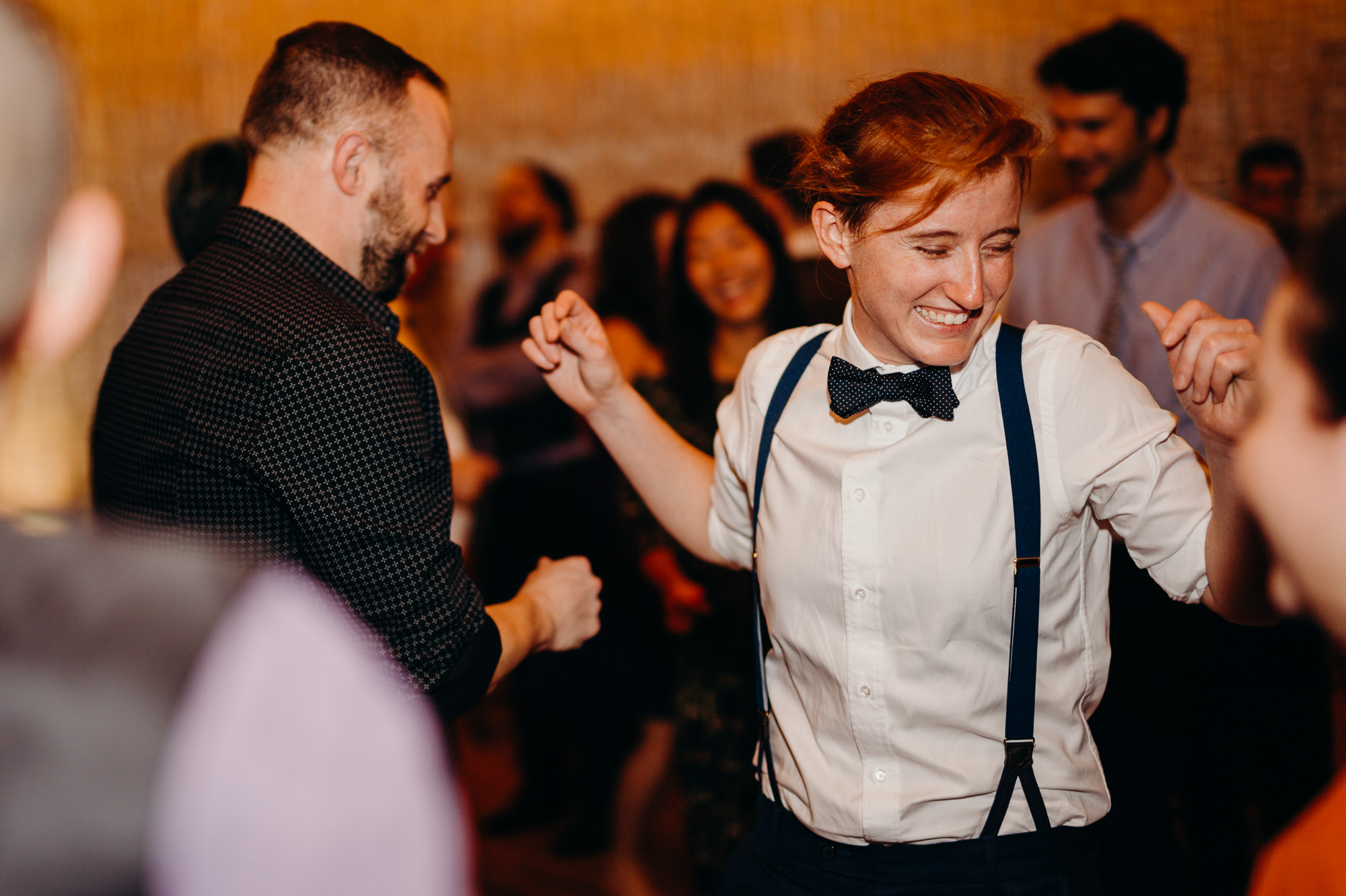 a guest dances during a wedding reception at dumbo loft in brooklyn, ny