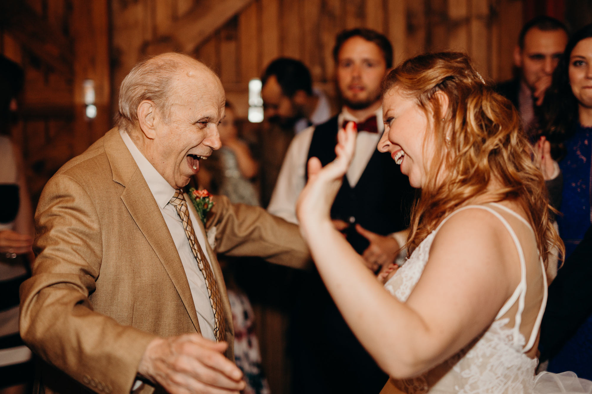 a bride dances with her grandfather at hayloft on the arch in syracuse, ny