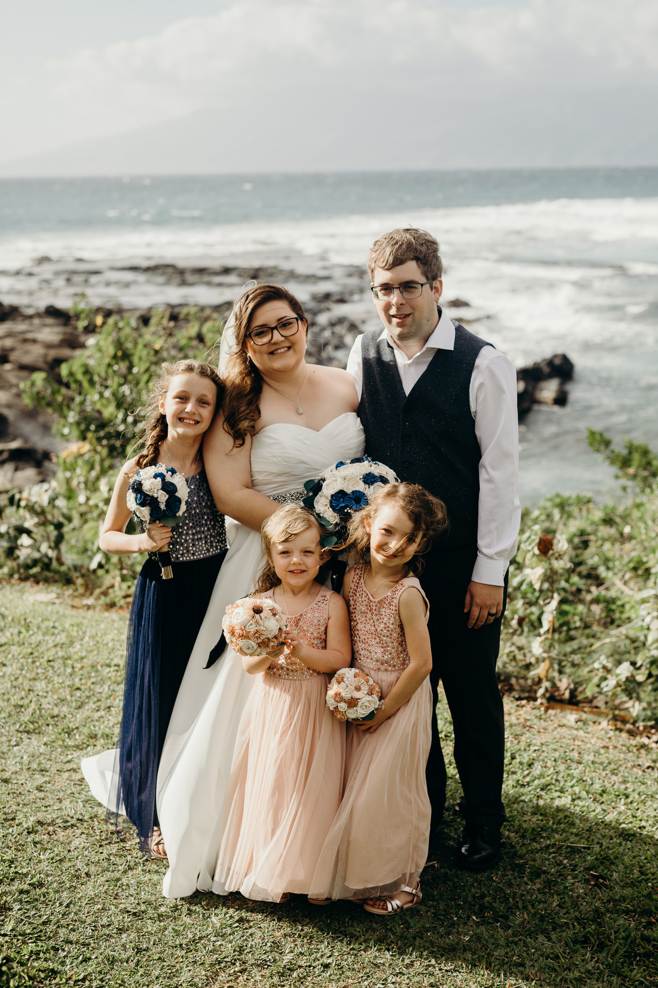 bride and groom with their neices at merriman's maui in kaanapali, HI