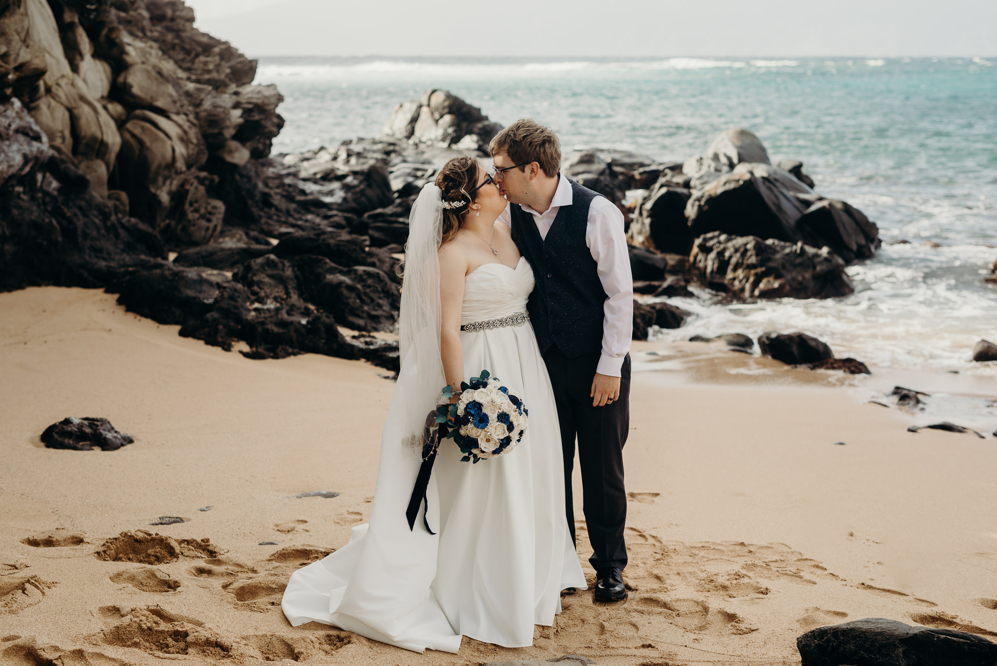 bride and groom portrait on the beach at merriman's maui in kaanapali, HI