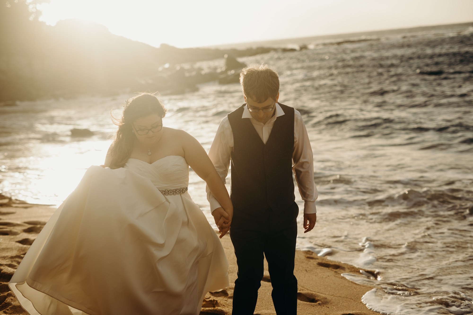 bride and groom portrait on the beach at merrimans maui in kaanapali, HI