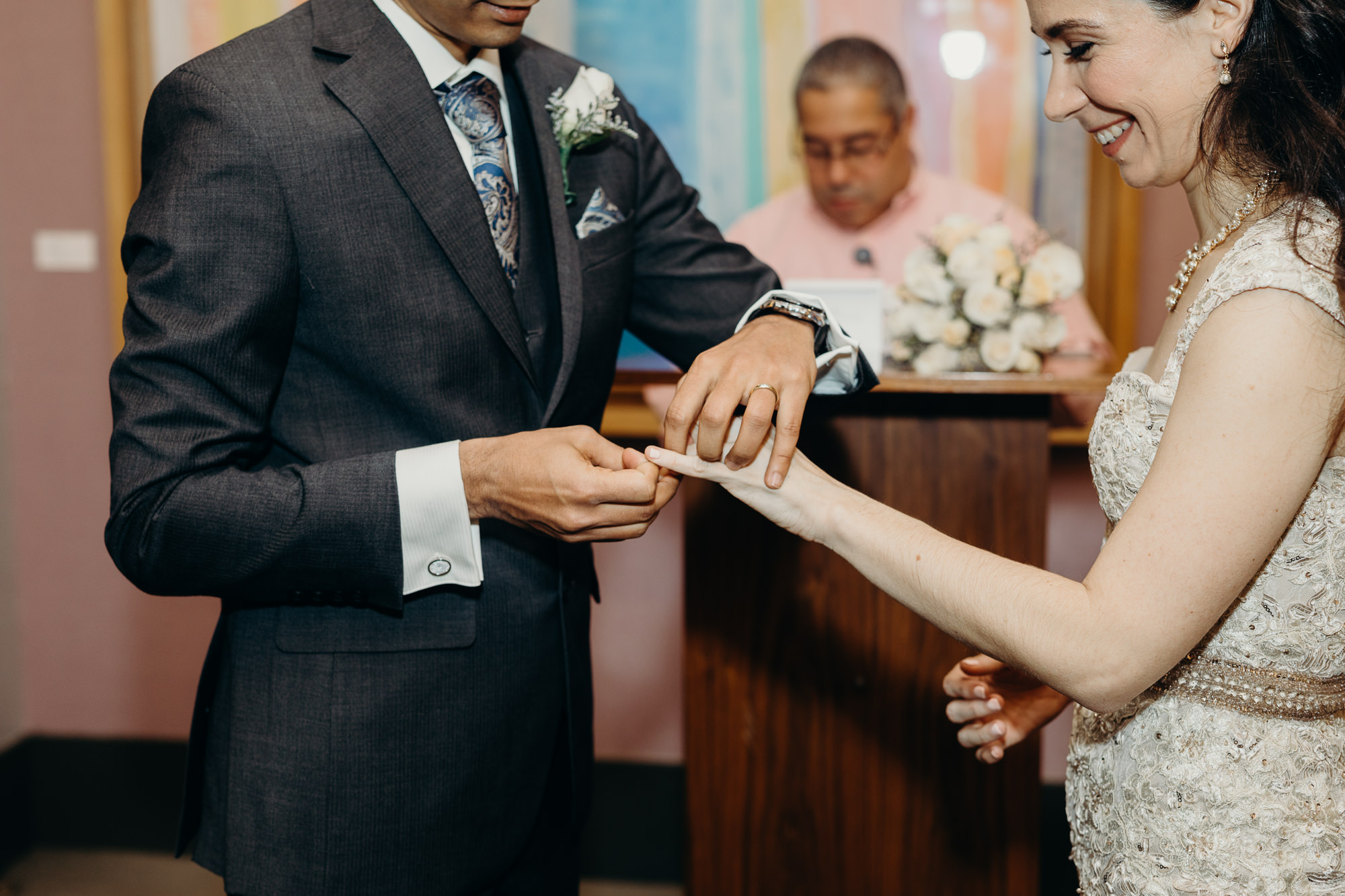 bride and groom during their wedding ceremony at city hall in new york city, ny