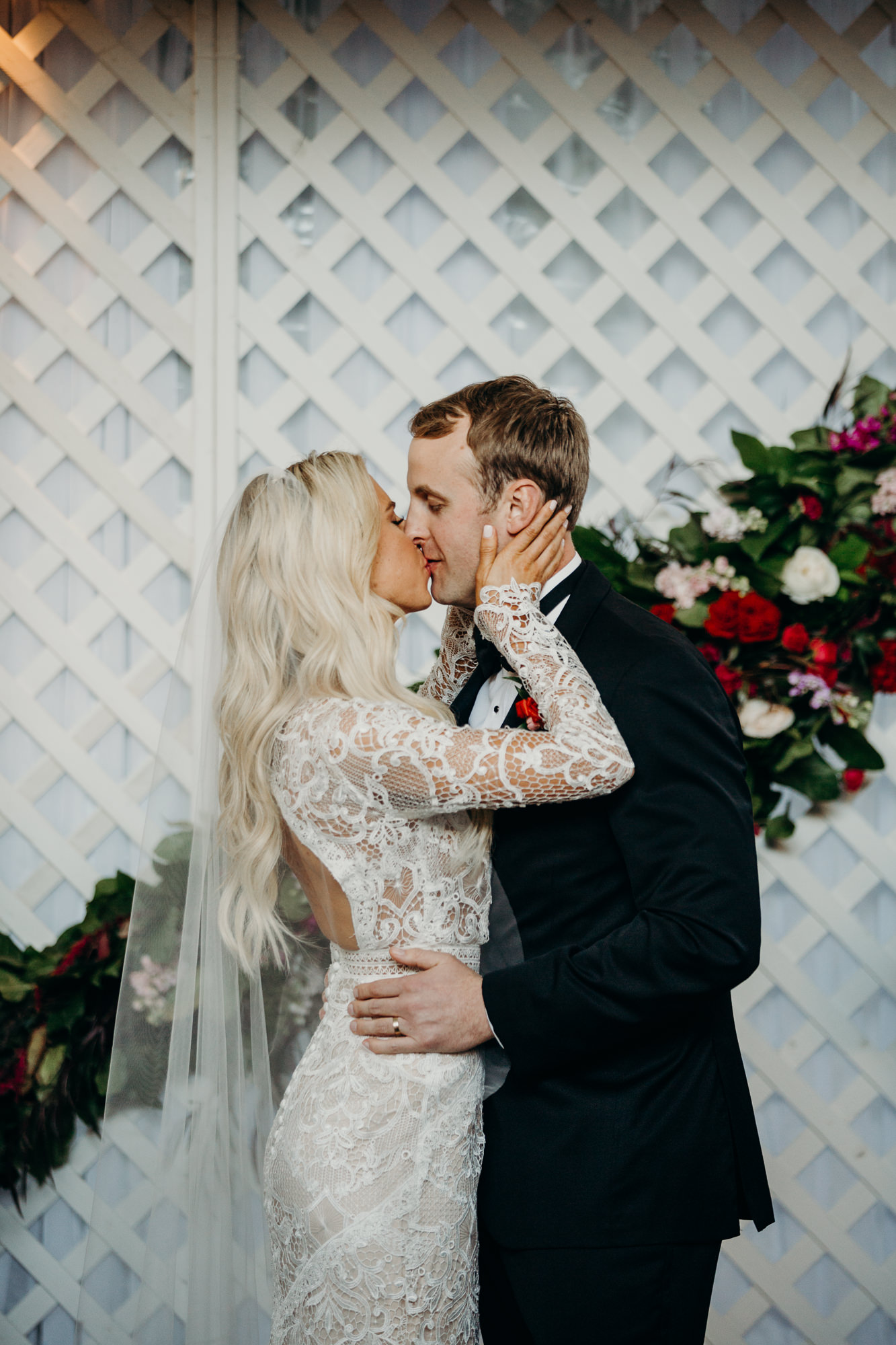 bride and groom kiss during wedding ceremony at five crowns in newport beach, CA
