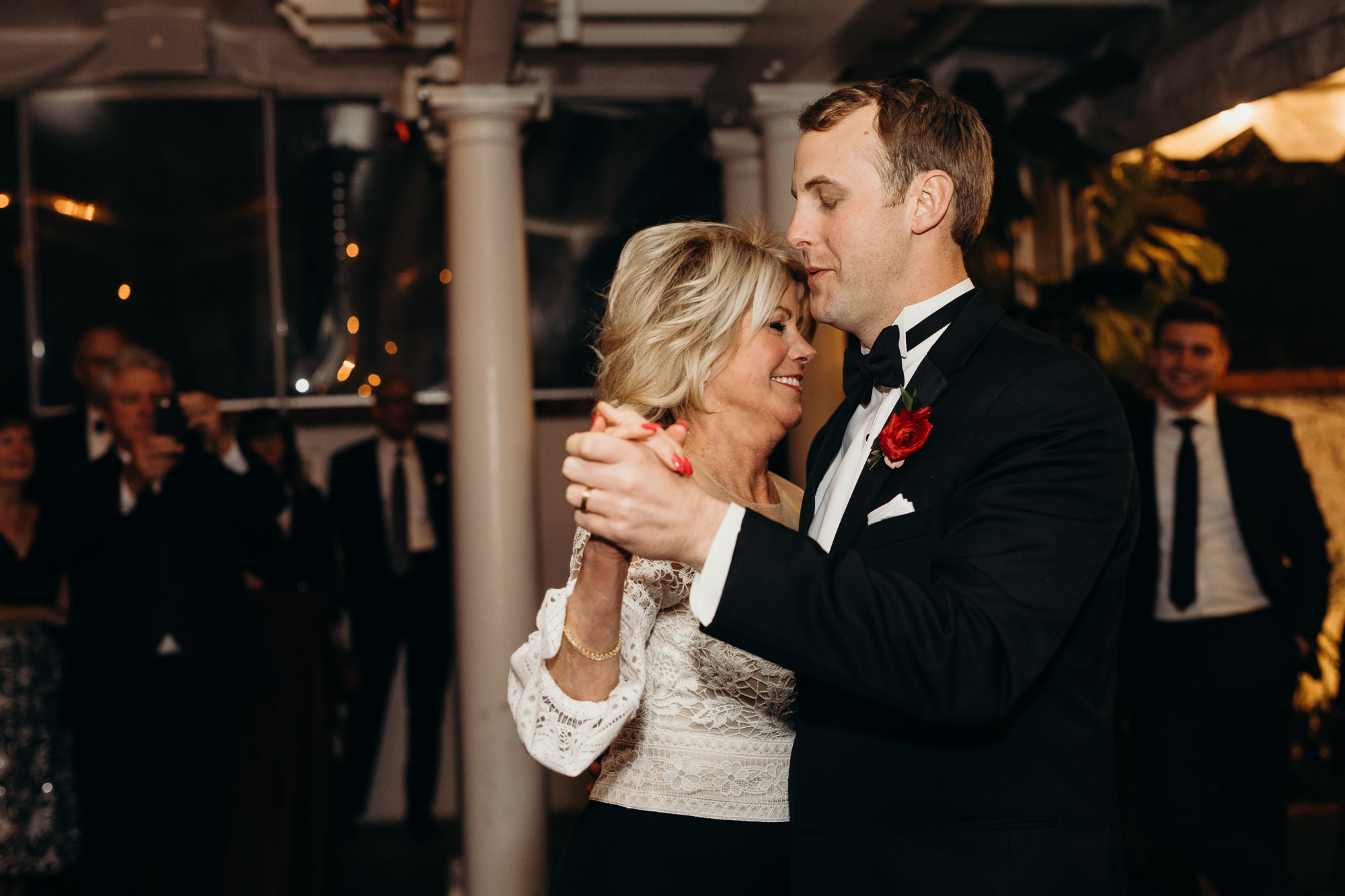 groom dances with mother at wedding reception at five crowns in newport beach, CA