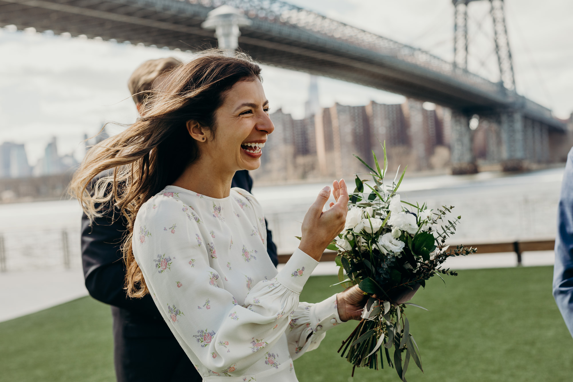 bride cries after her wedding ceremony at domino park in brooklyn, new york