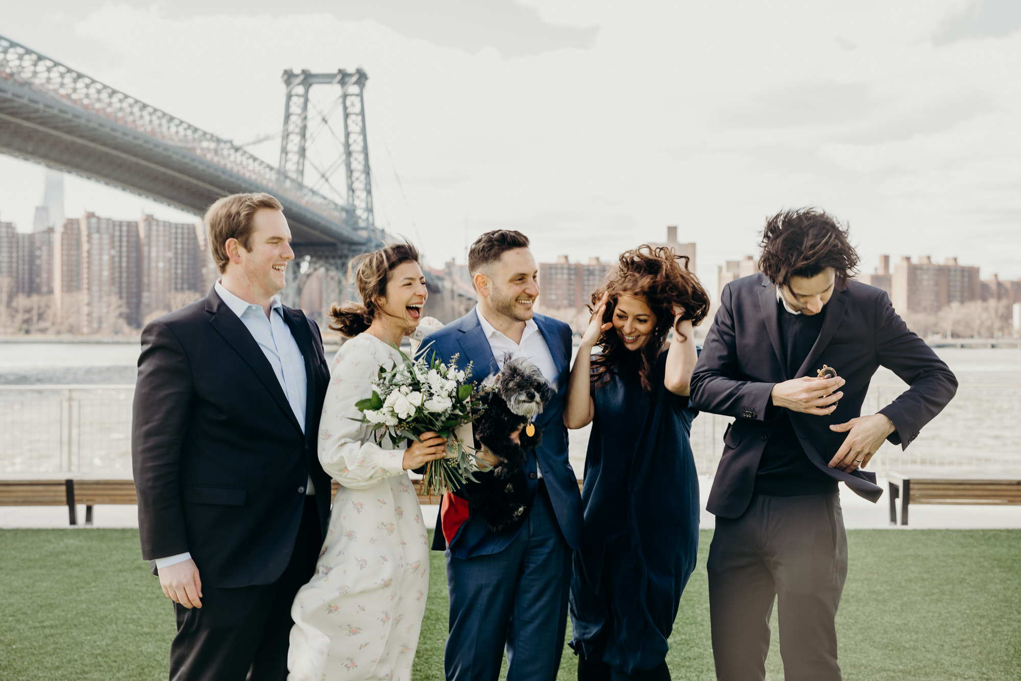 portrait of a wedding party at domino park in brooklyn, ny