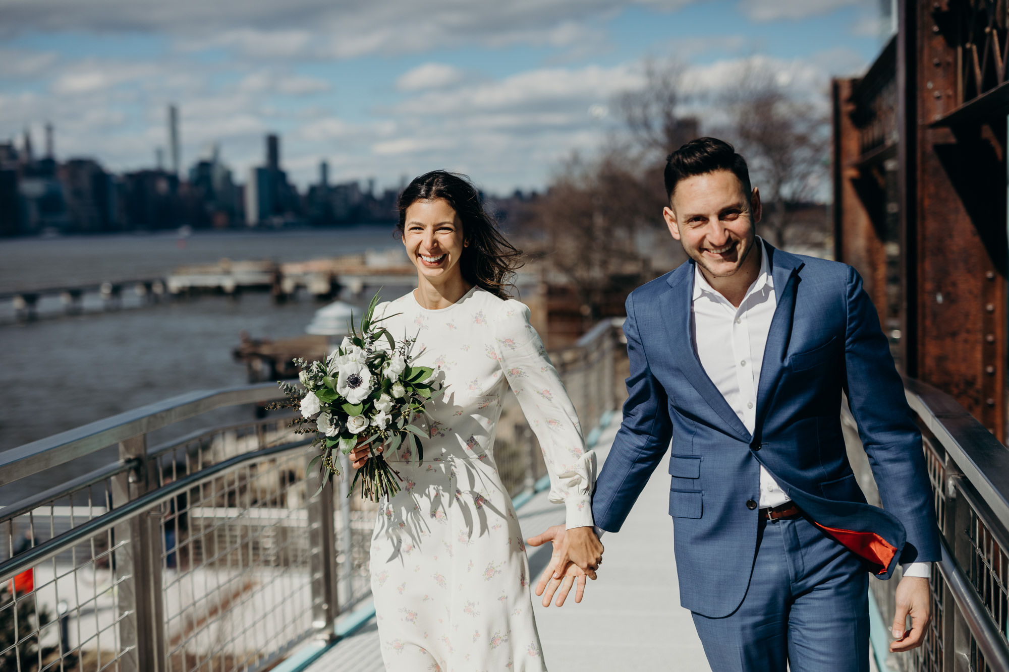 portrait of a bride and groom on their wedding day at domino park in brooklyn, ny