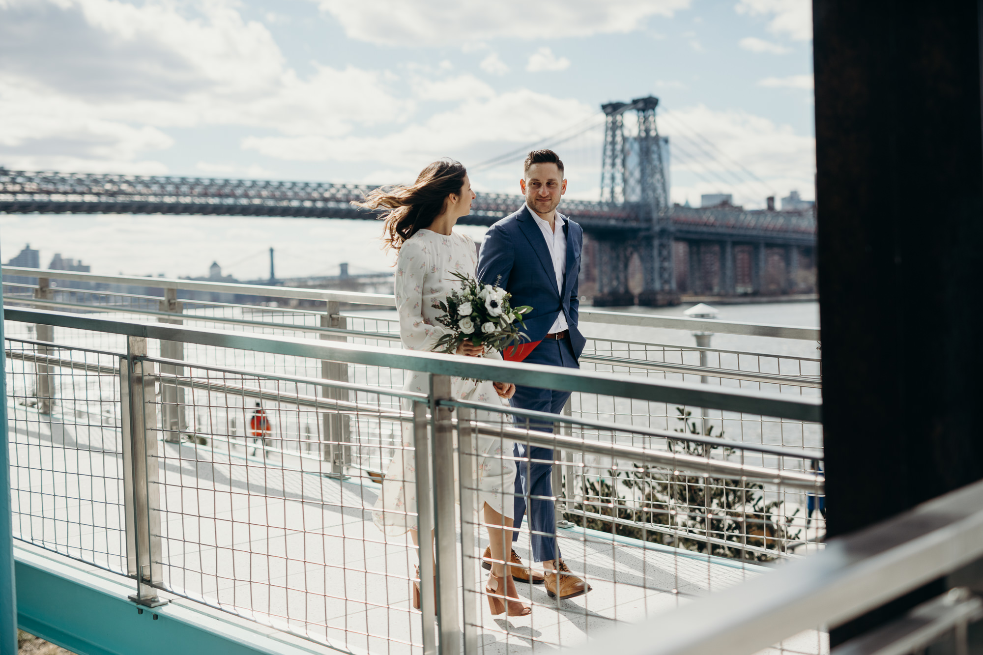 portrait of a bride and groom on their wedding day at domino park in brooklyn, ny