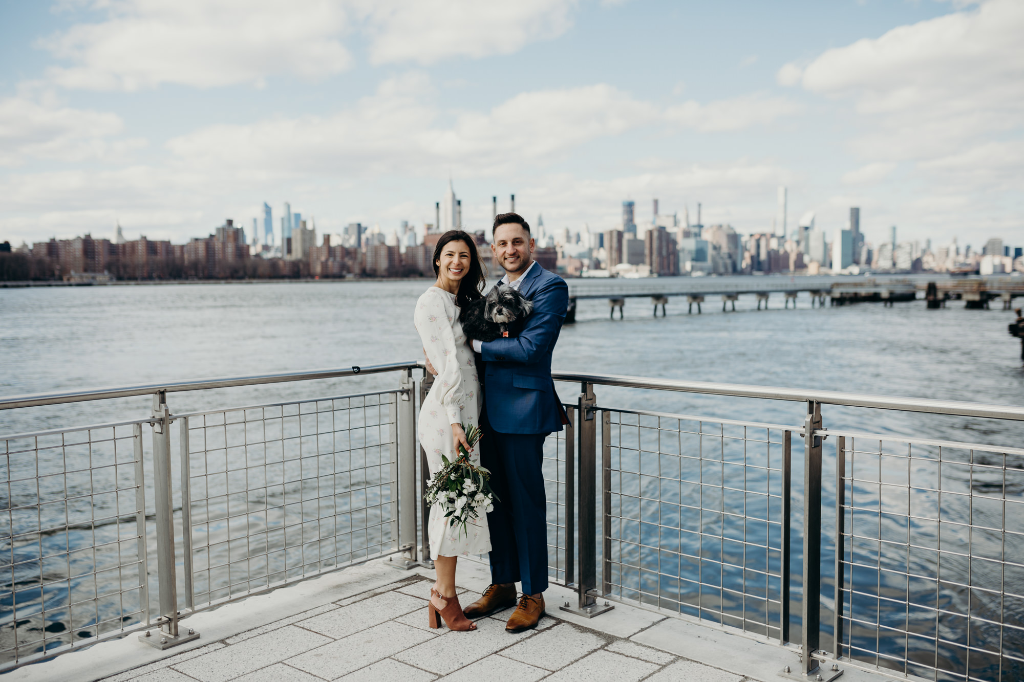 portrait of a bride and groom on their wedding day at domino park in brooklyn, ny