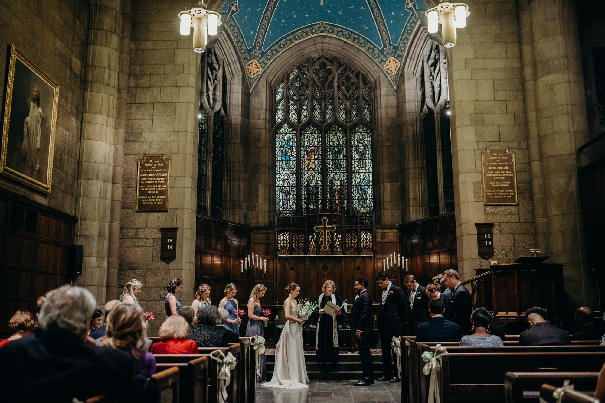 bride and groom during their wedding ceremony at church in new york city, ny