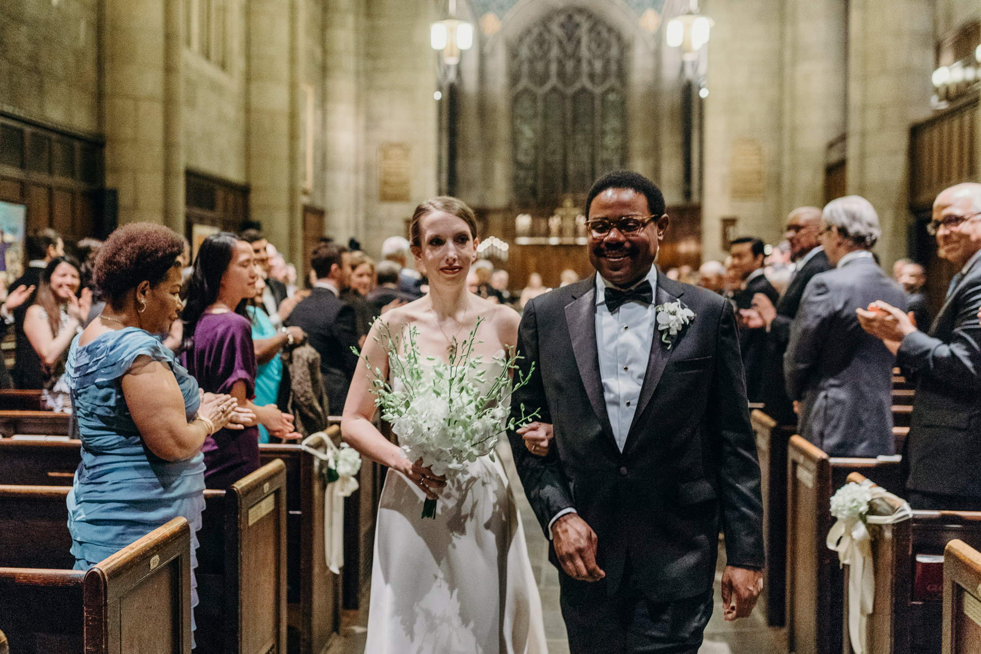 bride and groom during their wedding ceremony at church in new york city, ny