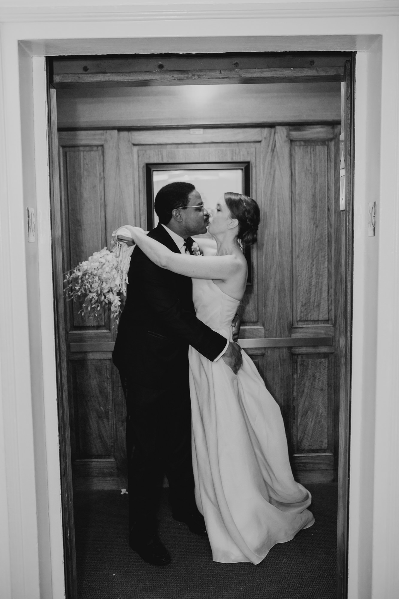 bride and groom portrait in an elevator at cosmopolitan club in new york city, ny