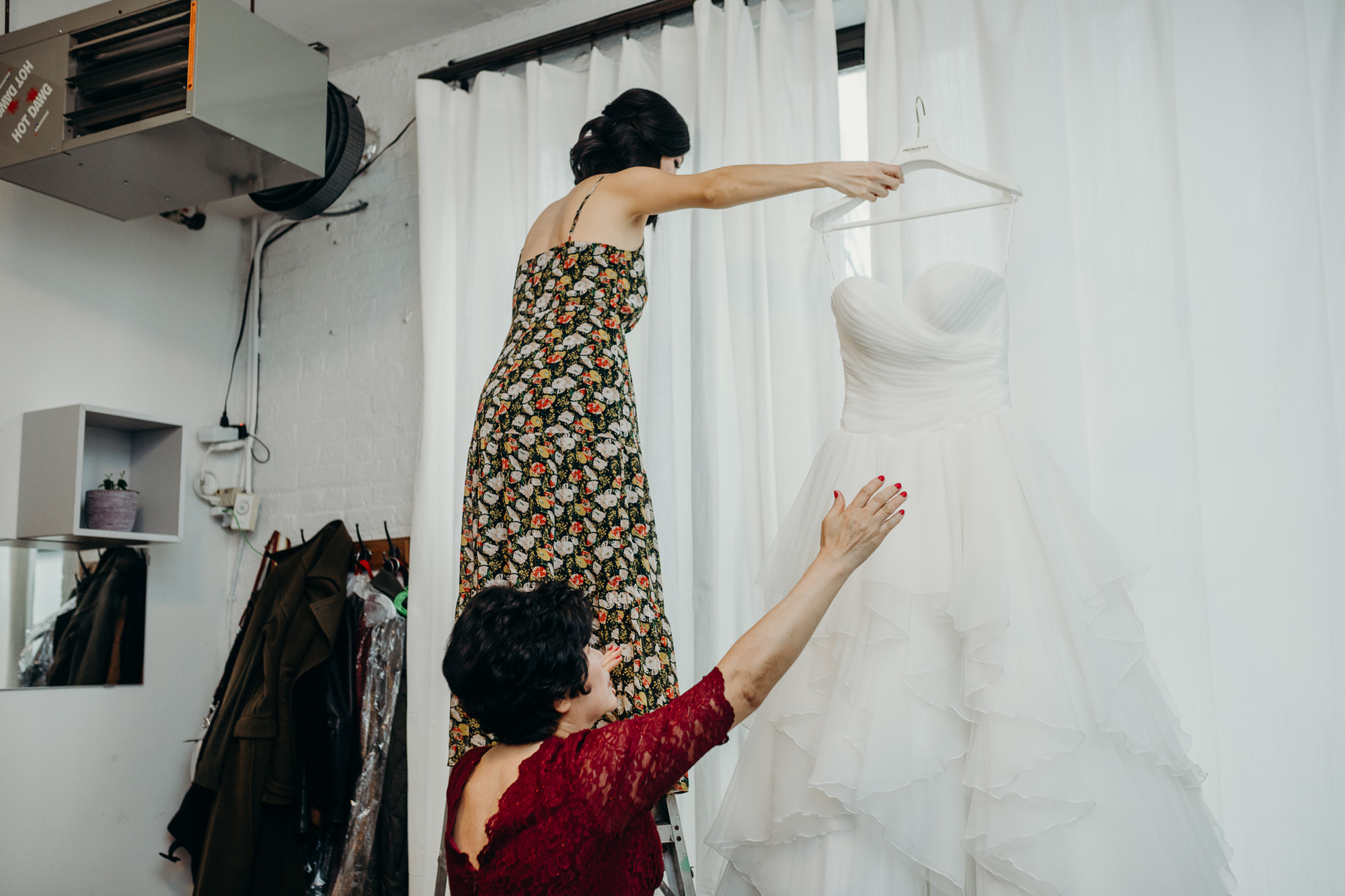 portrait of a bride taking her wedding dress at mymoon in brooklyn, new york