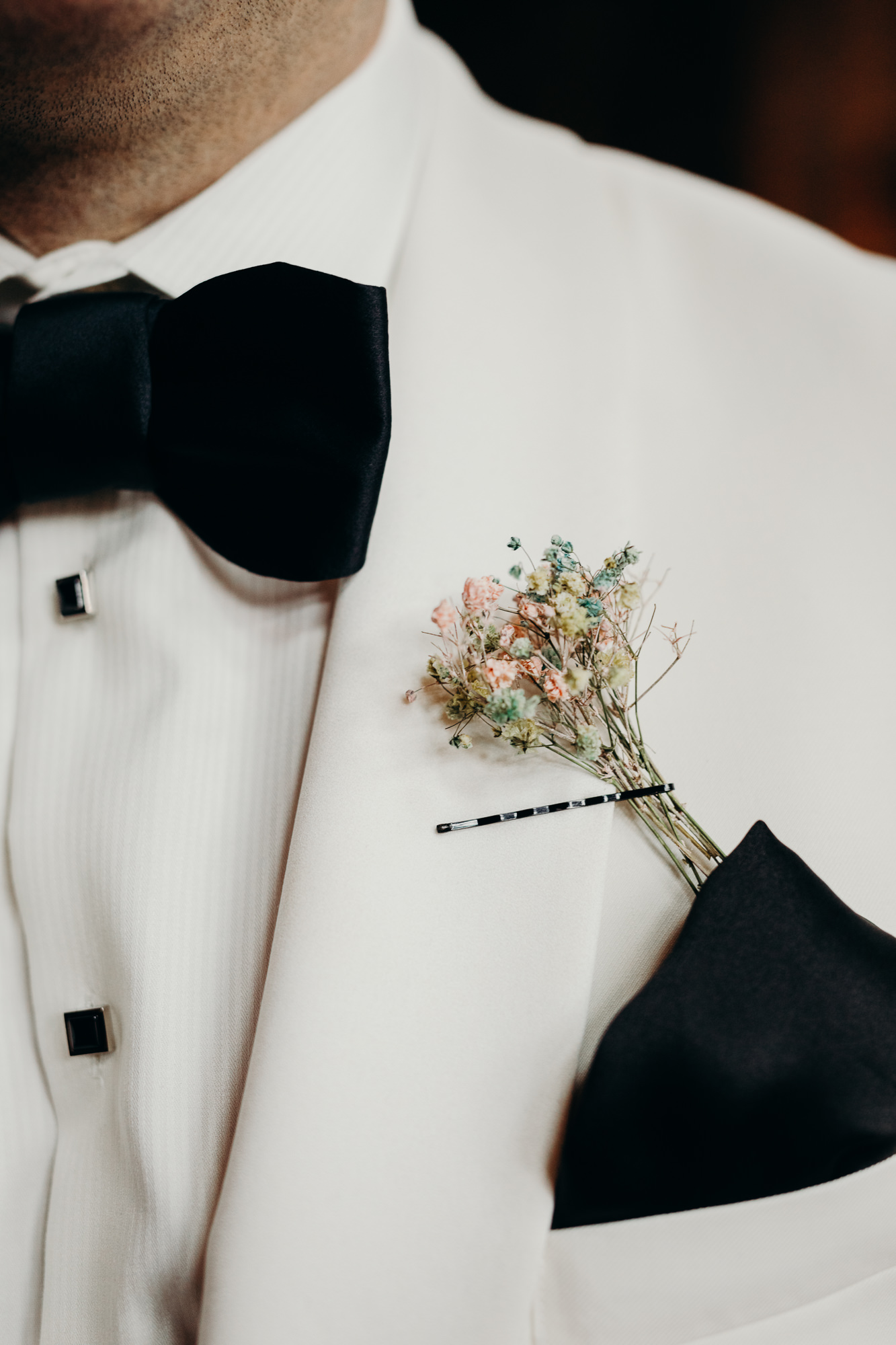 detail of a grooms boutonniere at mymoon in brooklyn, new york