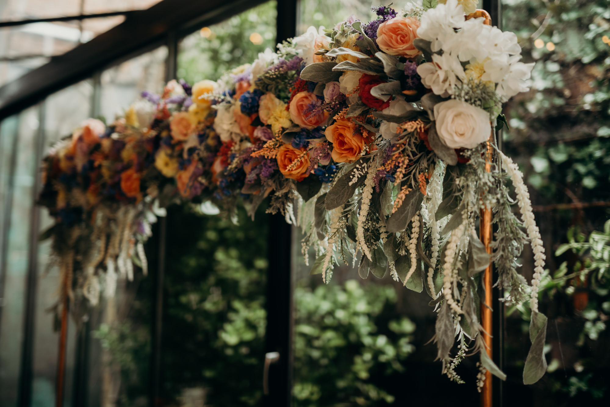 a floral wedding arch at mymoon in brooklyn, new york