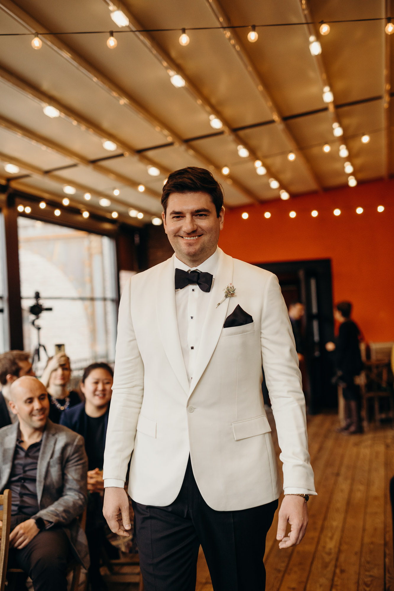 groom walks down the aisle at mymoon in brooklyn, new york