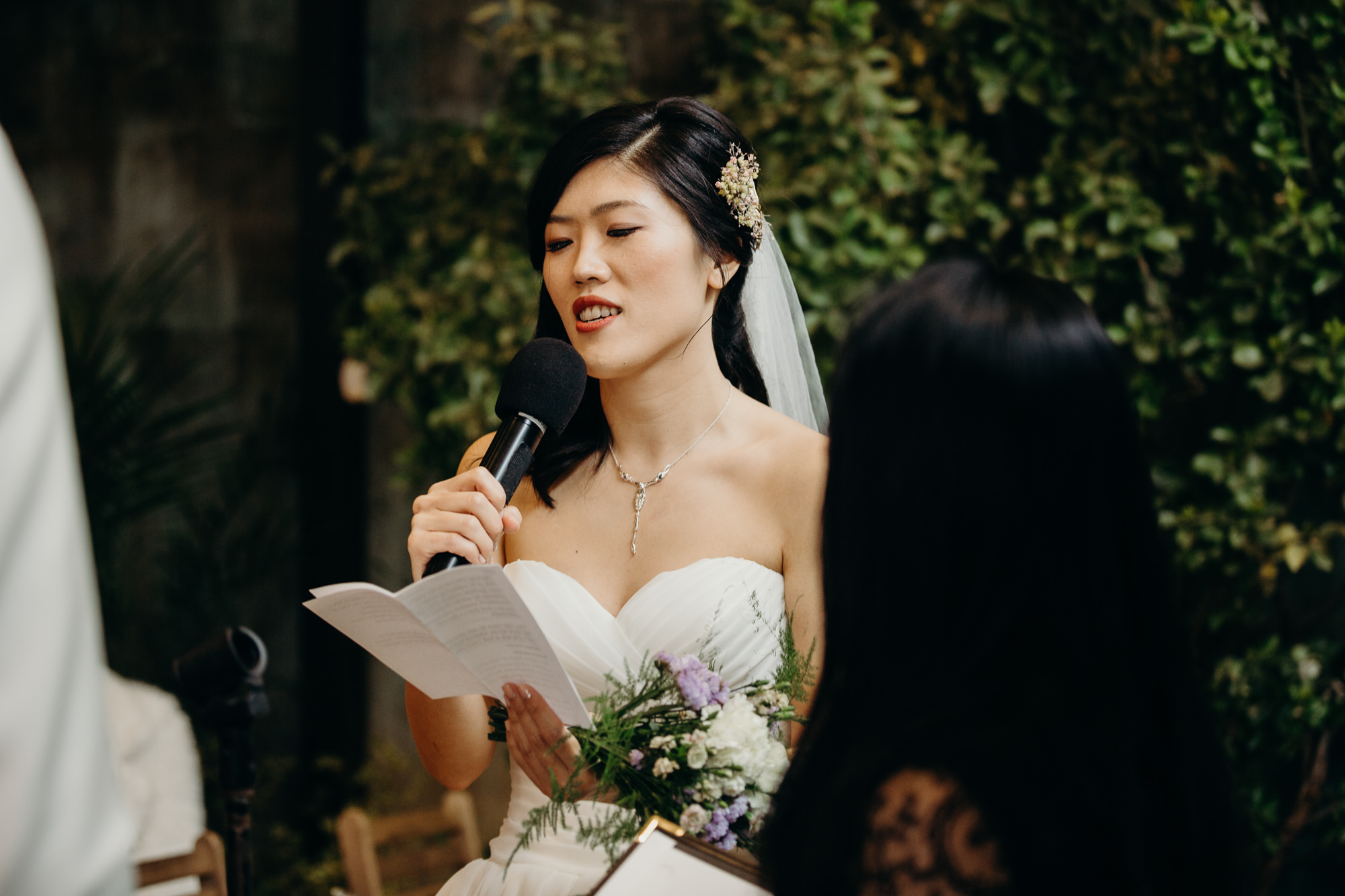 a bride recites her vows at mymoon in brooklyn, new york