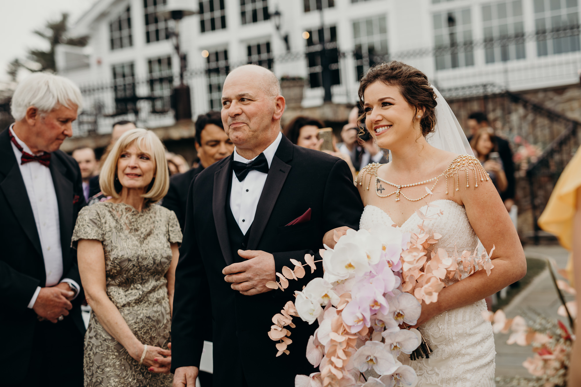 a bride walks down the aisle at the park savoy in florham park, new jersey