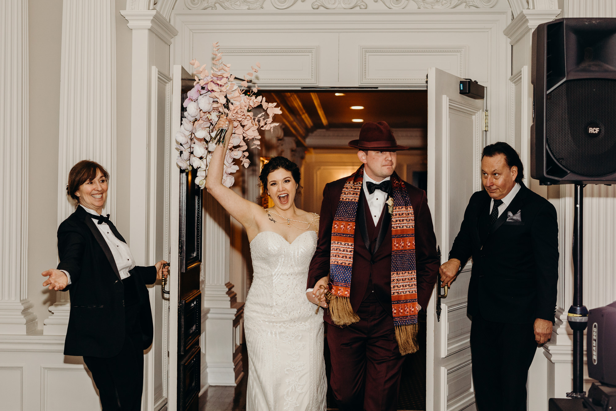 bride and groom enter the reception at the park savoy in florham park, new jersey