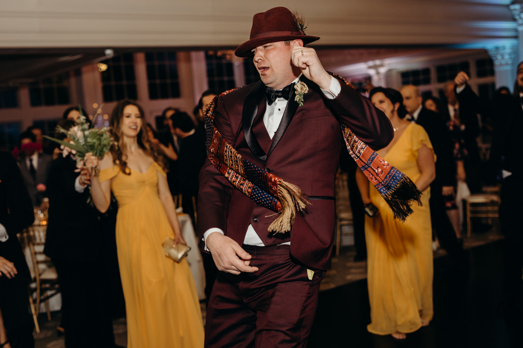 a groom enters the reception at the park savoy in florham park, new jersey