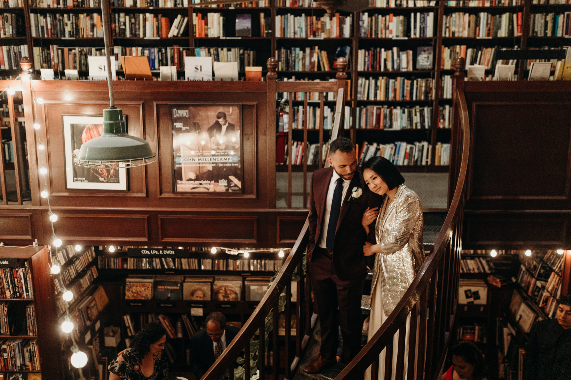 a portrait of a bride and groom at housingworks bookstore in new york, new york