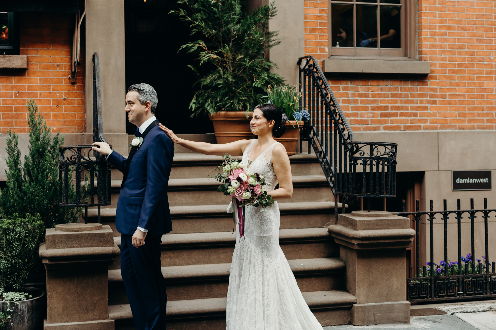 a portrait of a bride and groom during their first look in the west village in new york city
