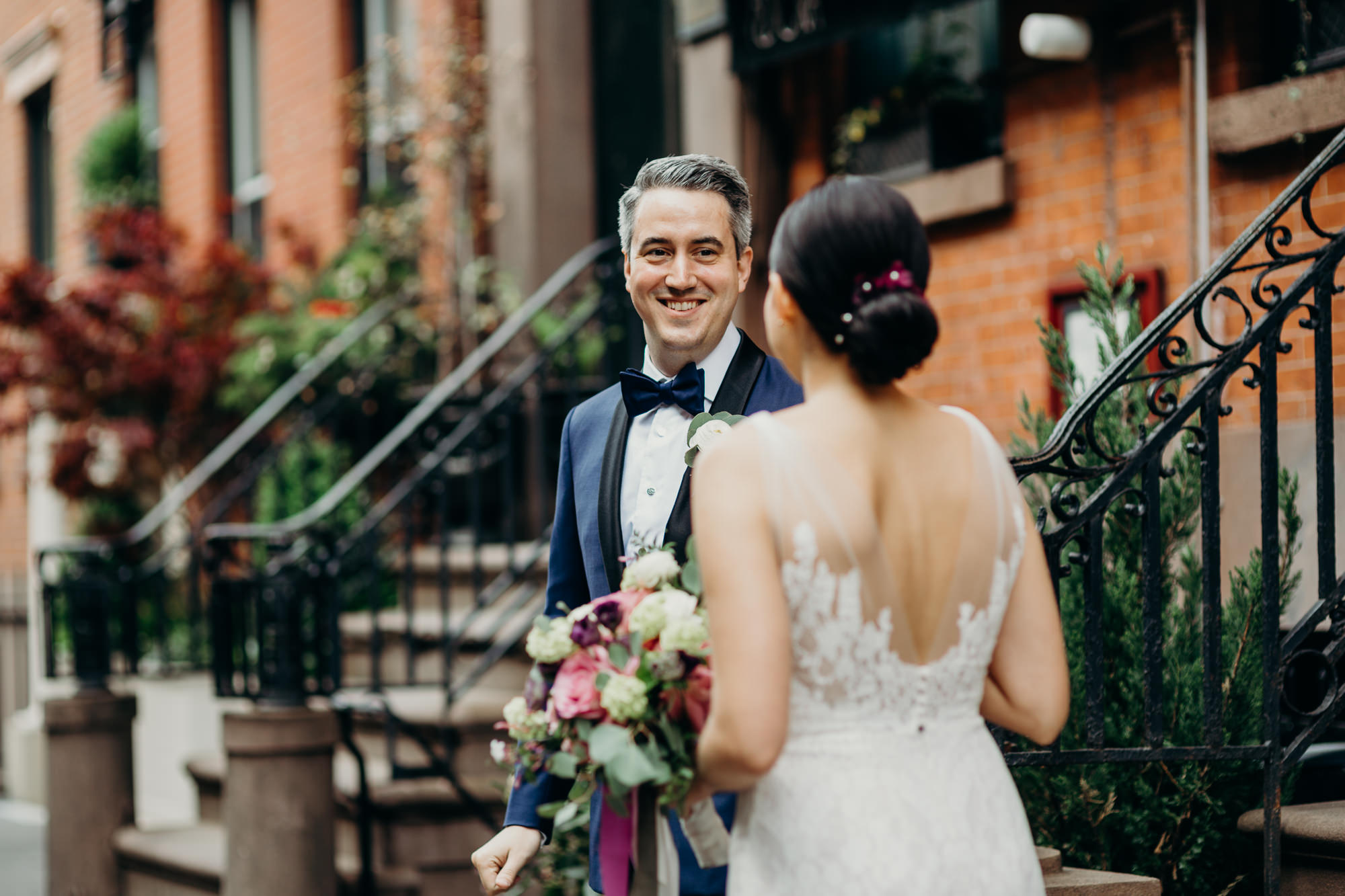 a portrait of a bride and groom during their first look in the west village in new york city