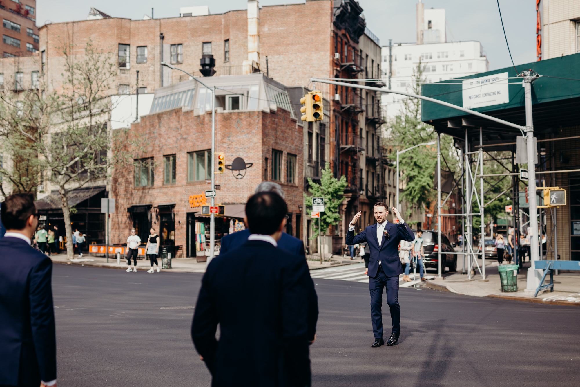a wedding party walks through the west village, new york city