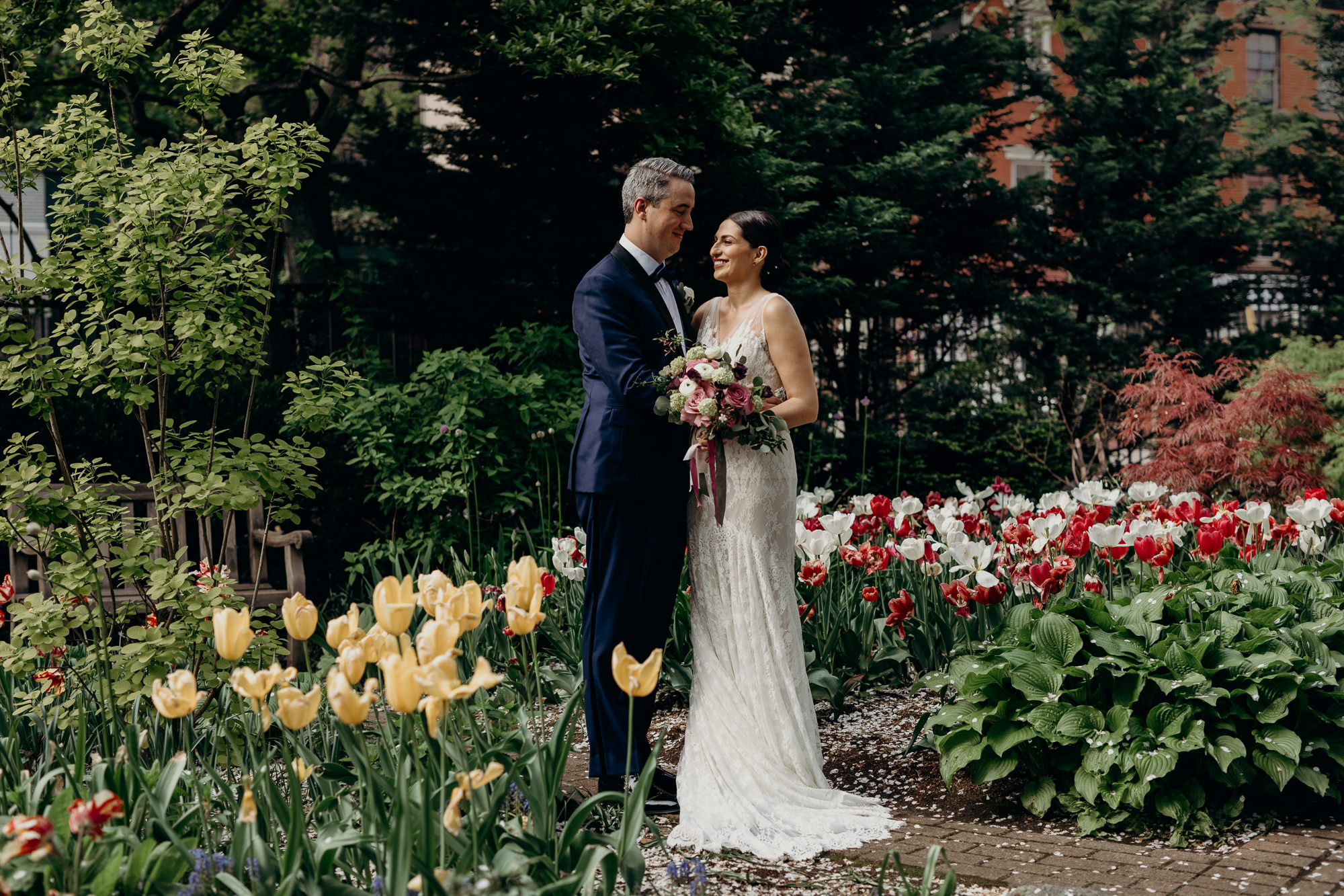 a portrait of a bride and groom at jefferson market garden in the west village, new york city