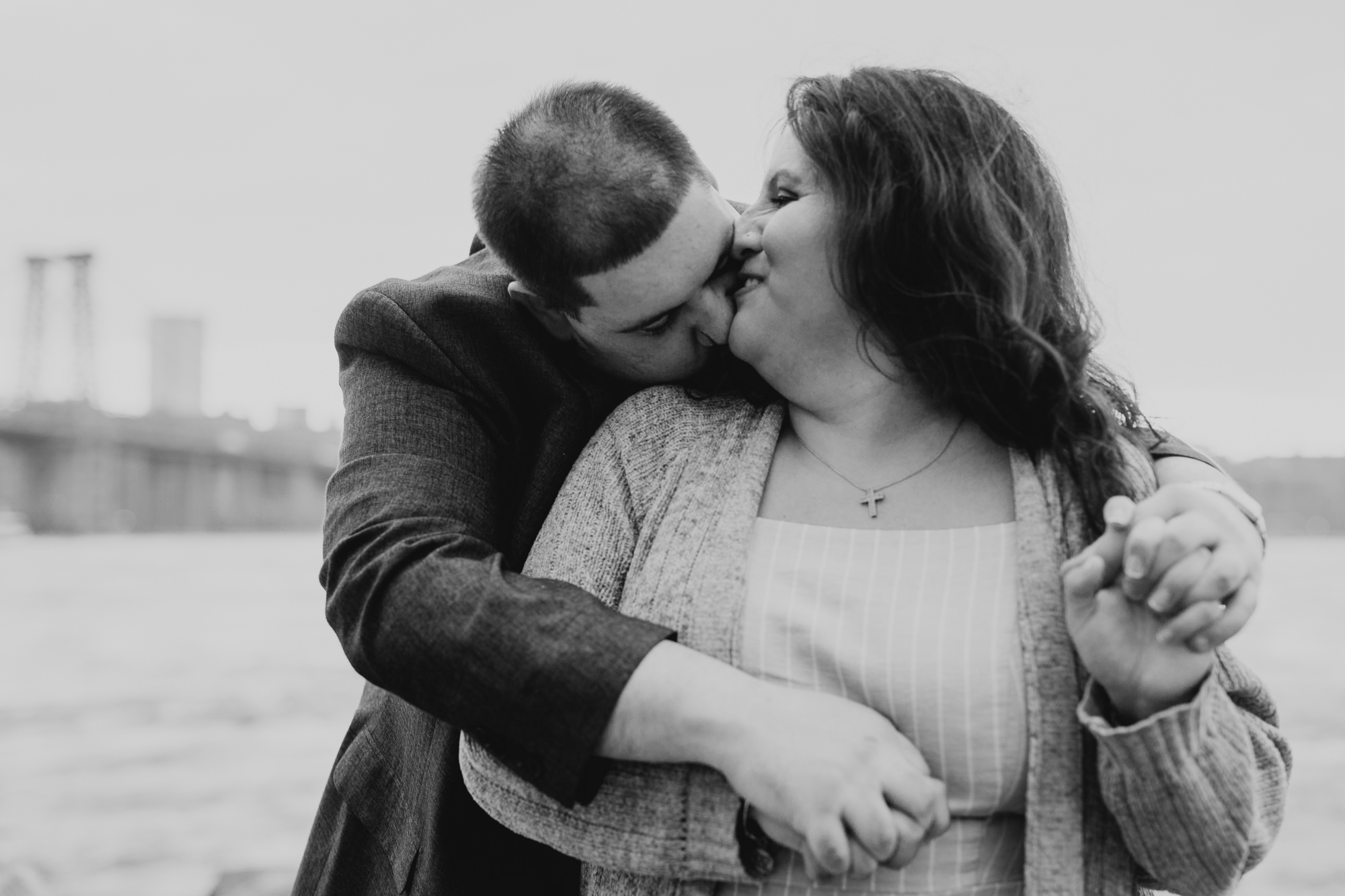 a portrait of a couple at the waterfront in williamsburg, brooklyn