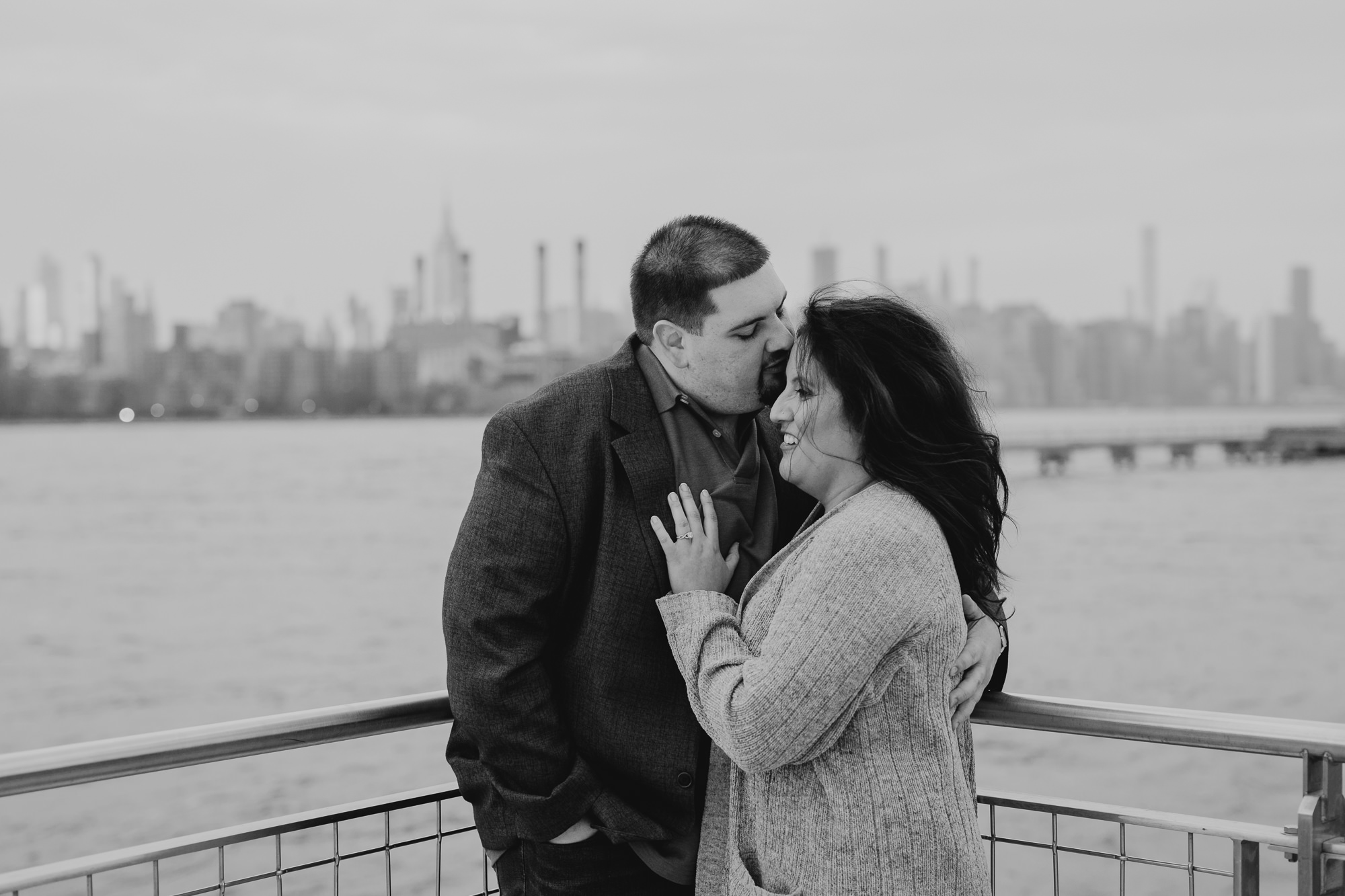 a portrait of a couple at the waterfront in williamsburg, brooklyn