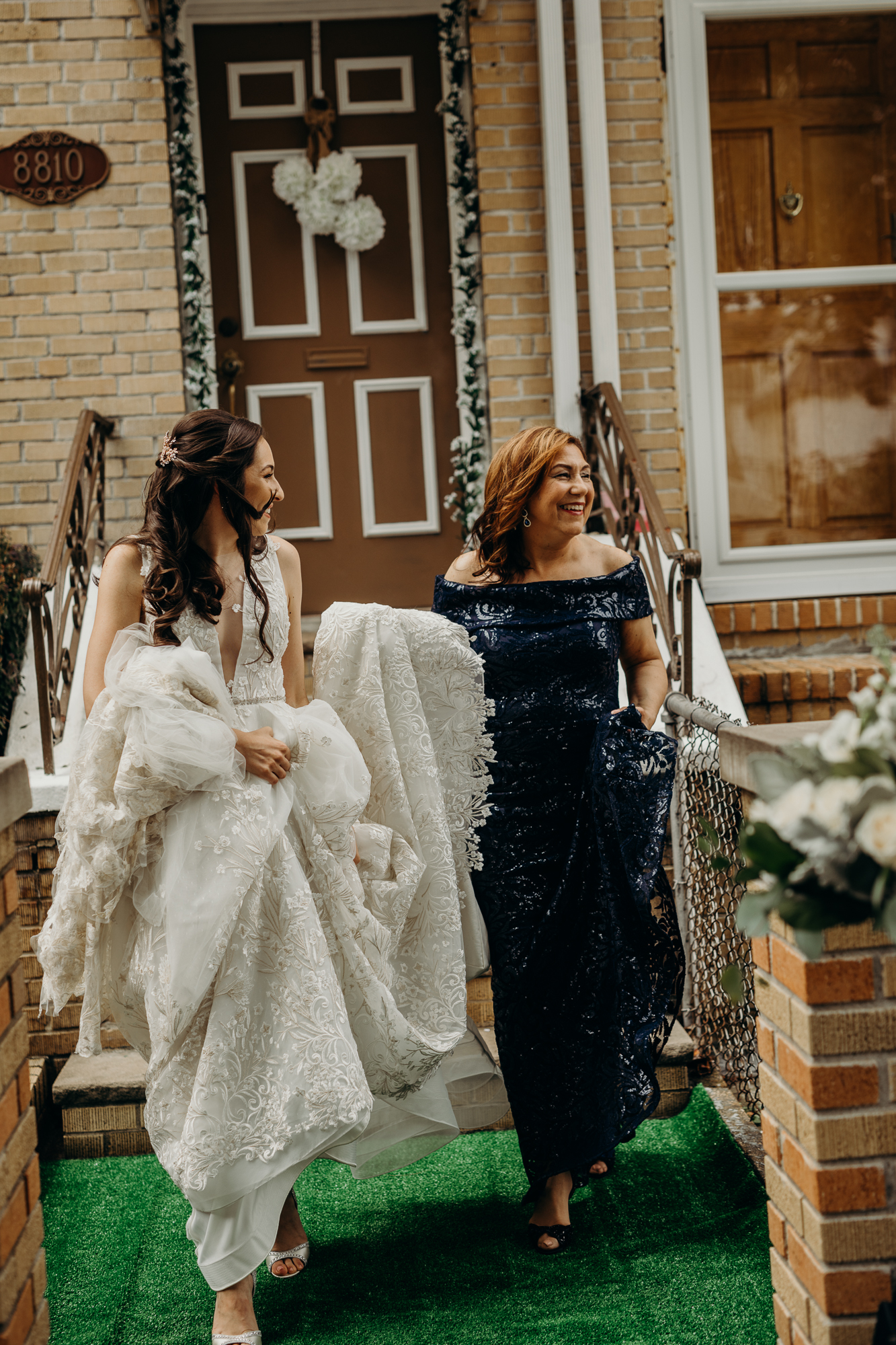 bride and her mother leaving her house at liberty warehouse in brooklyn, new york city