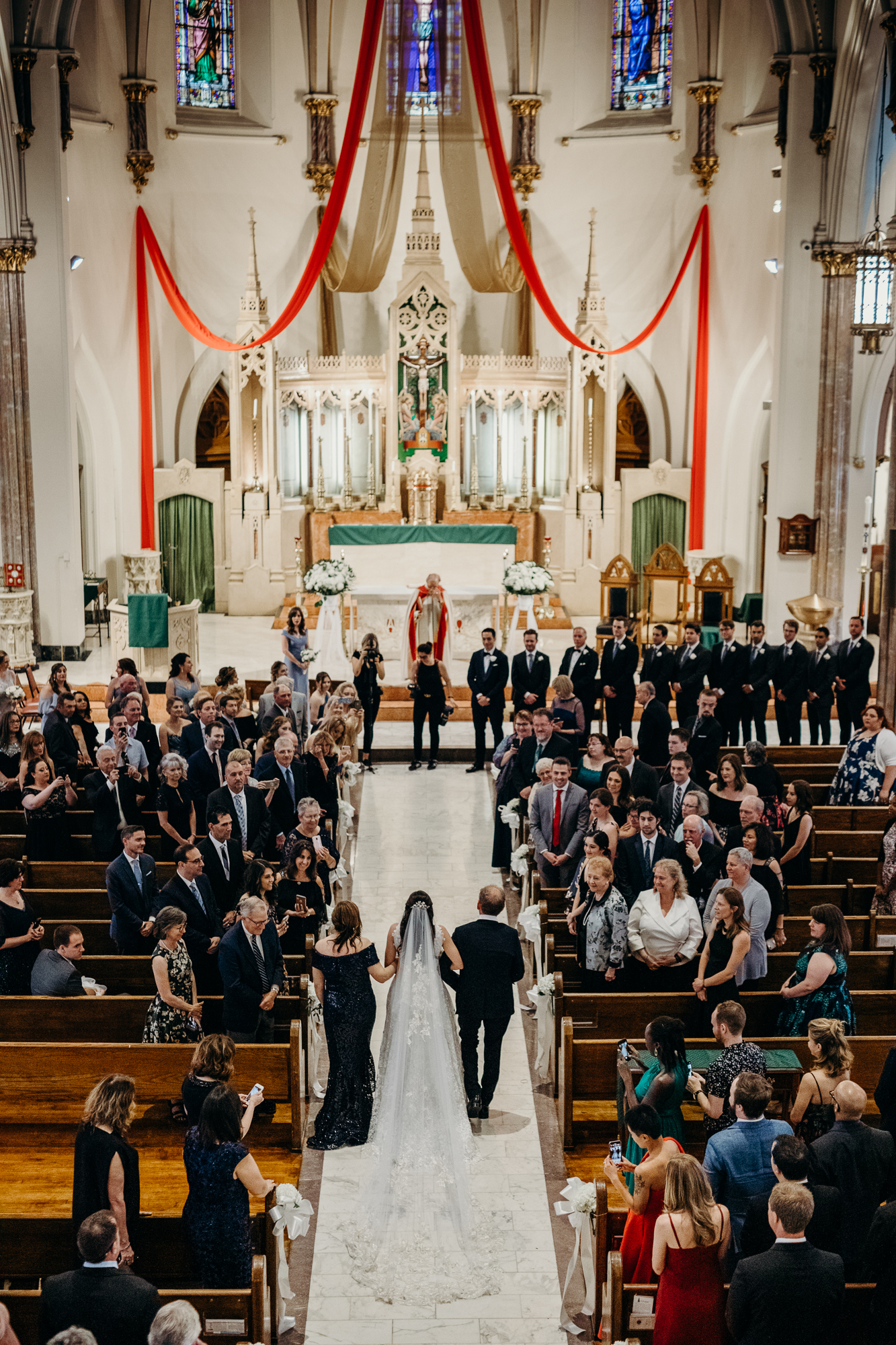 a bride walks down the aisle at a wedding chapel in brooklyn, new york city
