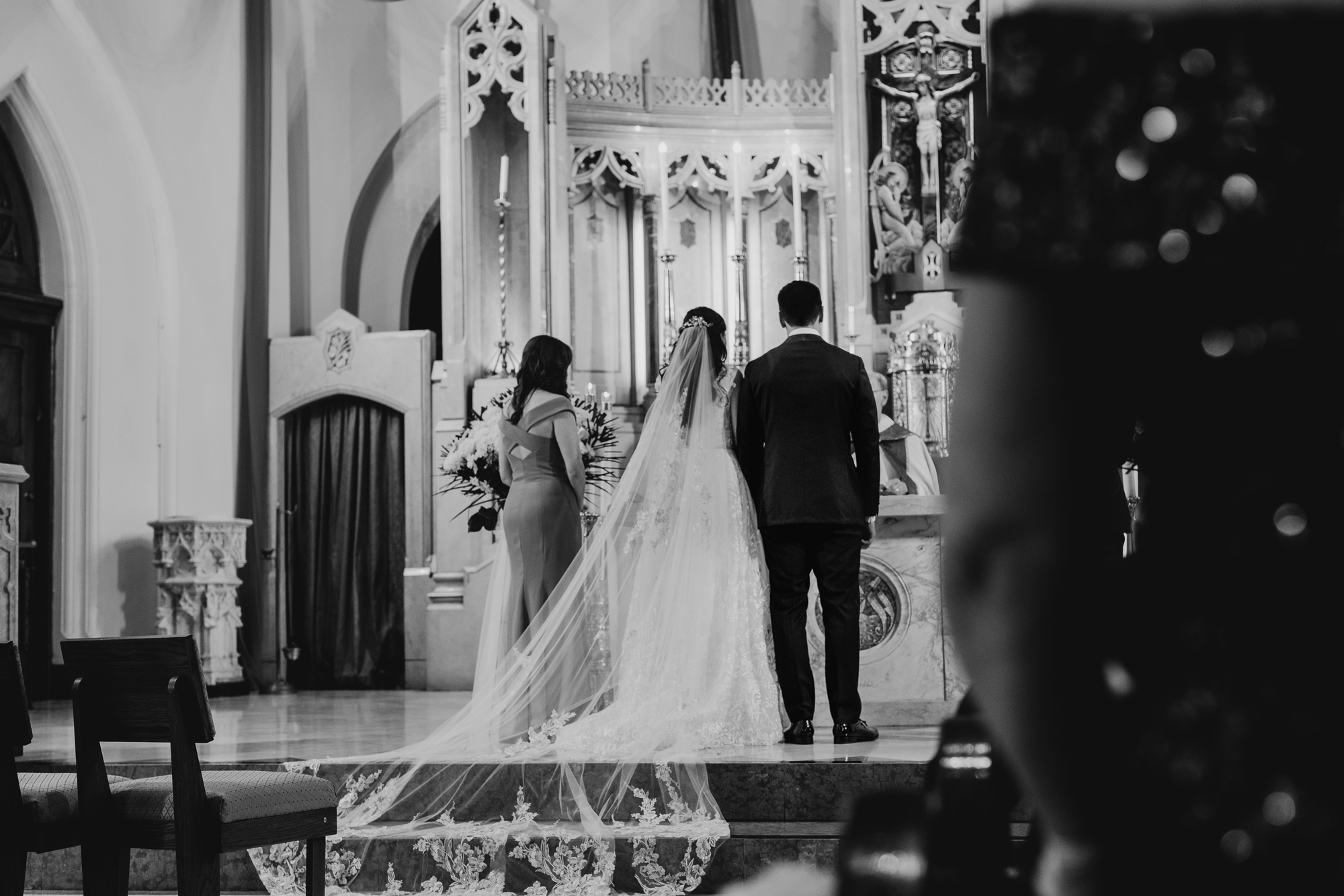 a bride and groom during their wedding ceremony at a church in bay ridge, brookyn