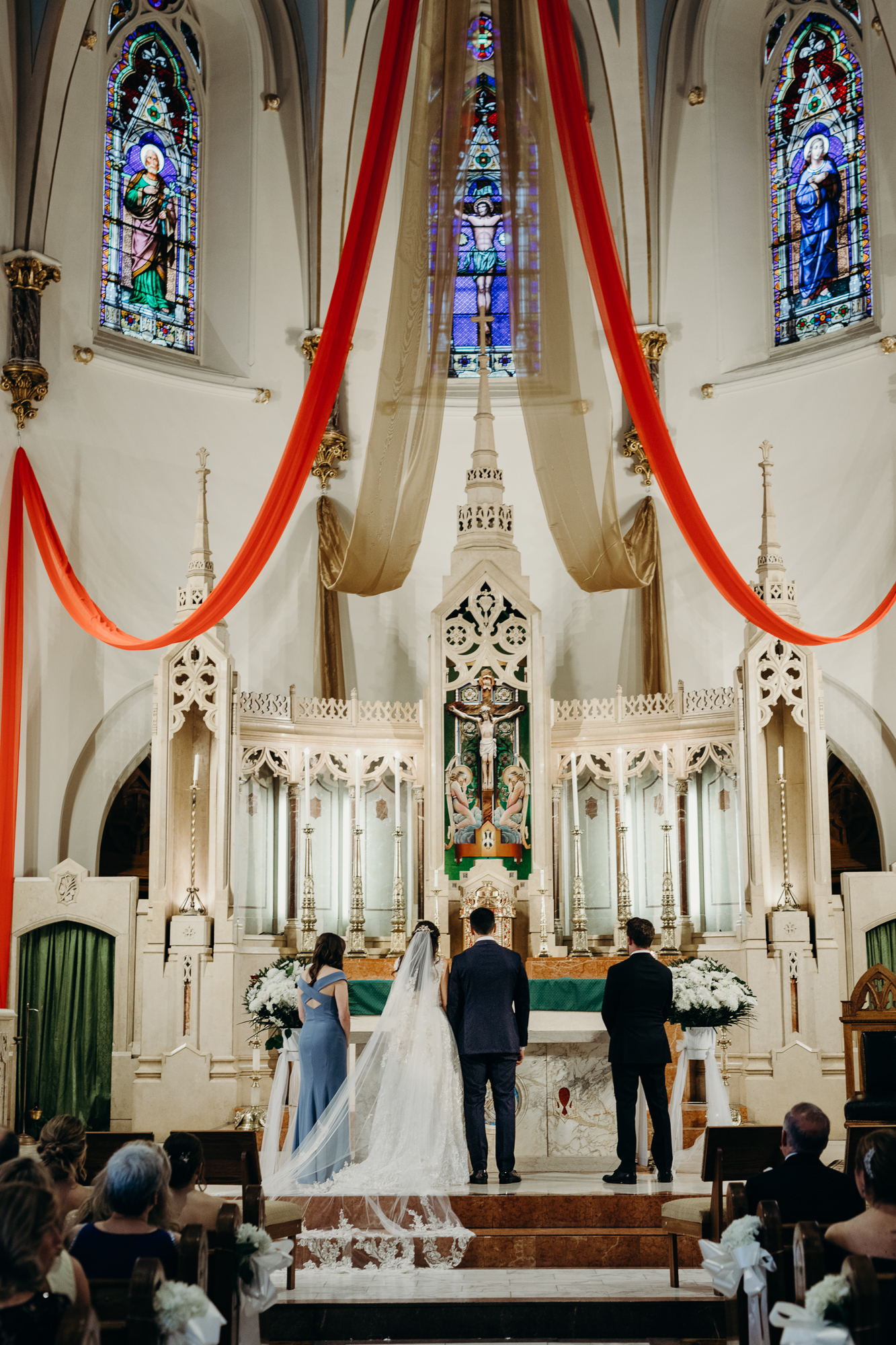 a bride and groom during their wedding ceremony at a church in bay ridge, brookyn