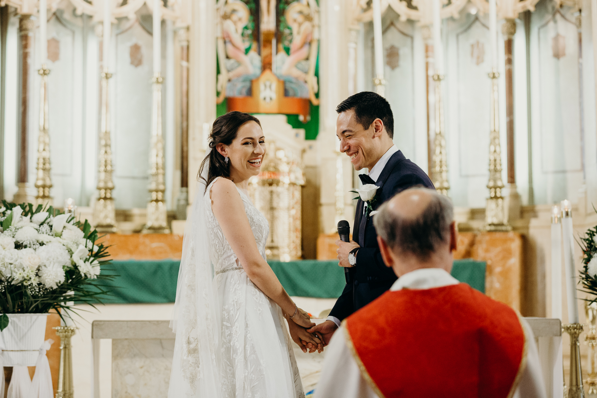 a bride and groom during their wedding ceremony at a church in bay ridge, brookyn