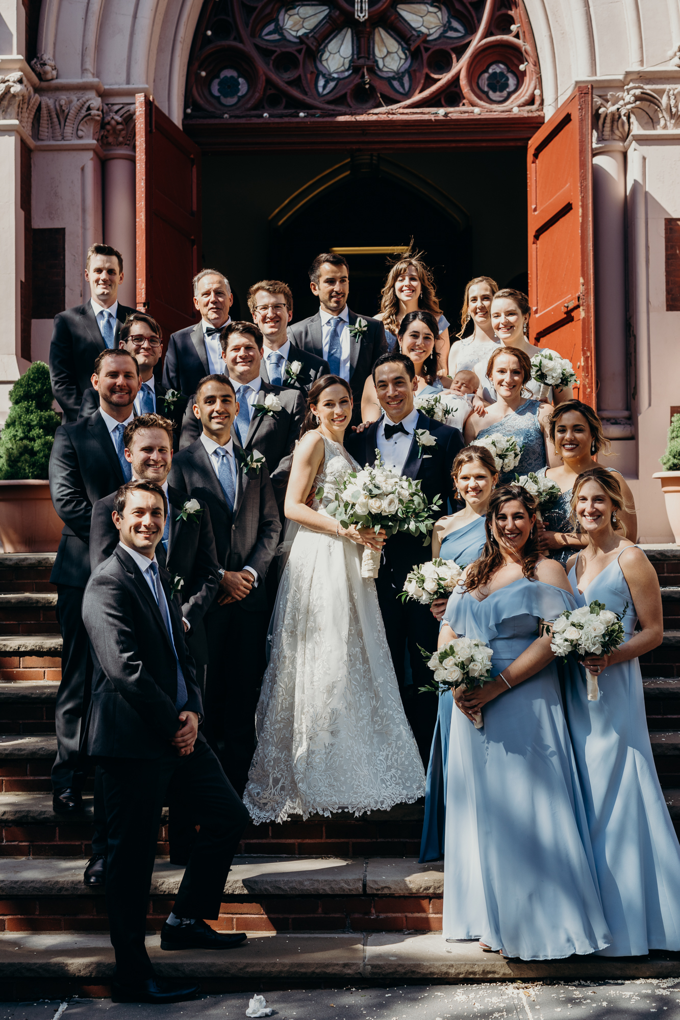 a portrait of a wedding party at a church in brooklyn, new york city